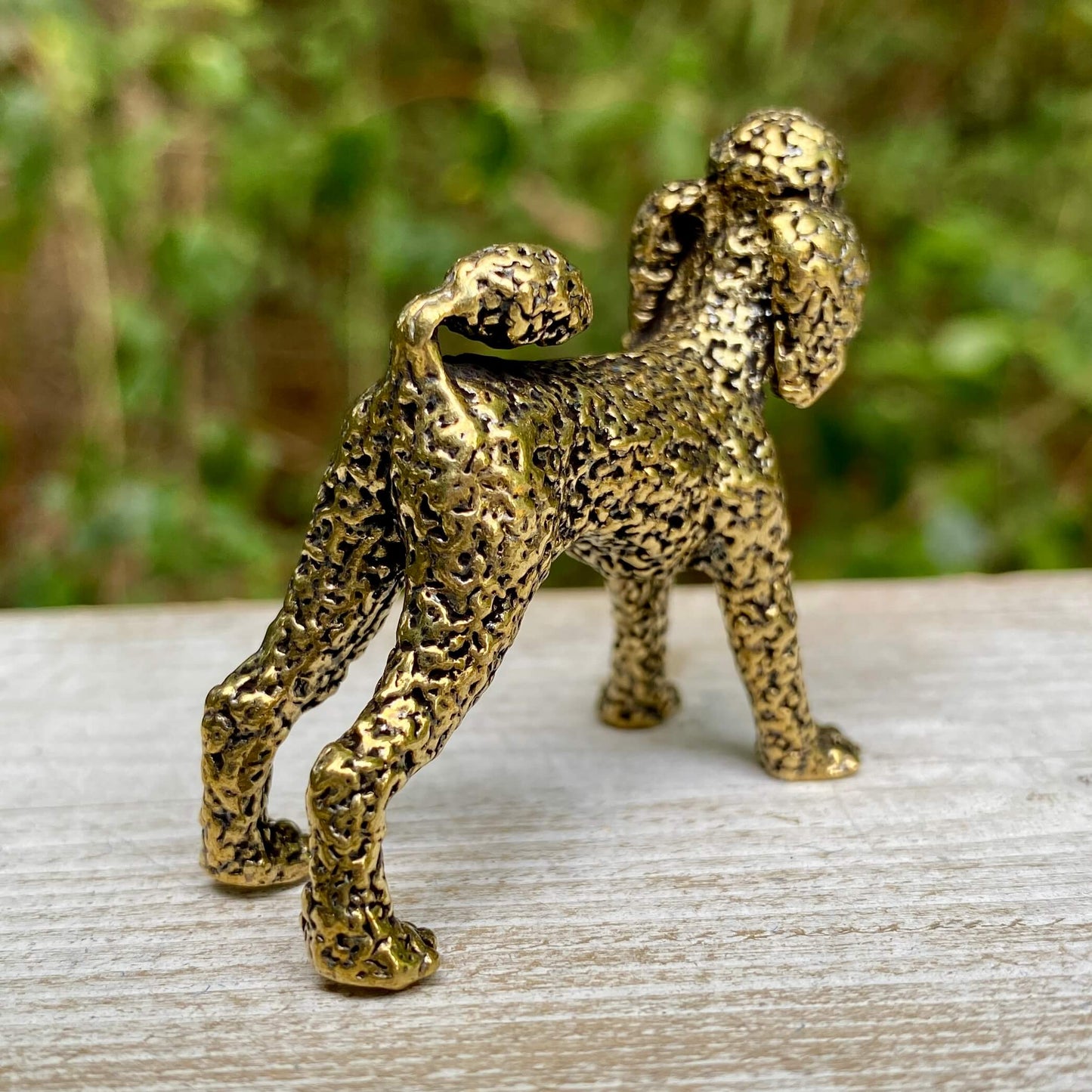 Solid brass poodle sculpture by Wild Brass, showcasing an elegant, detailed dog figure symbolizing loyalty and intelligence.