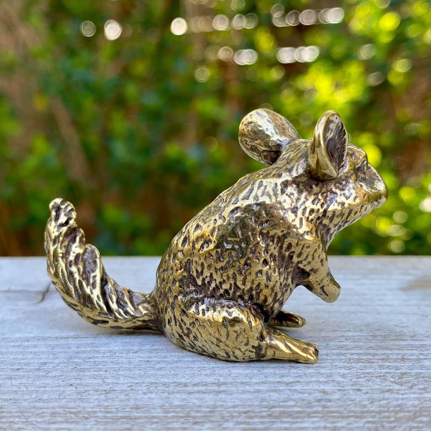 Solid brass chinchilla figurine by Wild Brass, symbol of joy, curiosity, and calm spirit, detailed and polished metal sculpture.