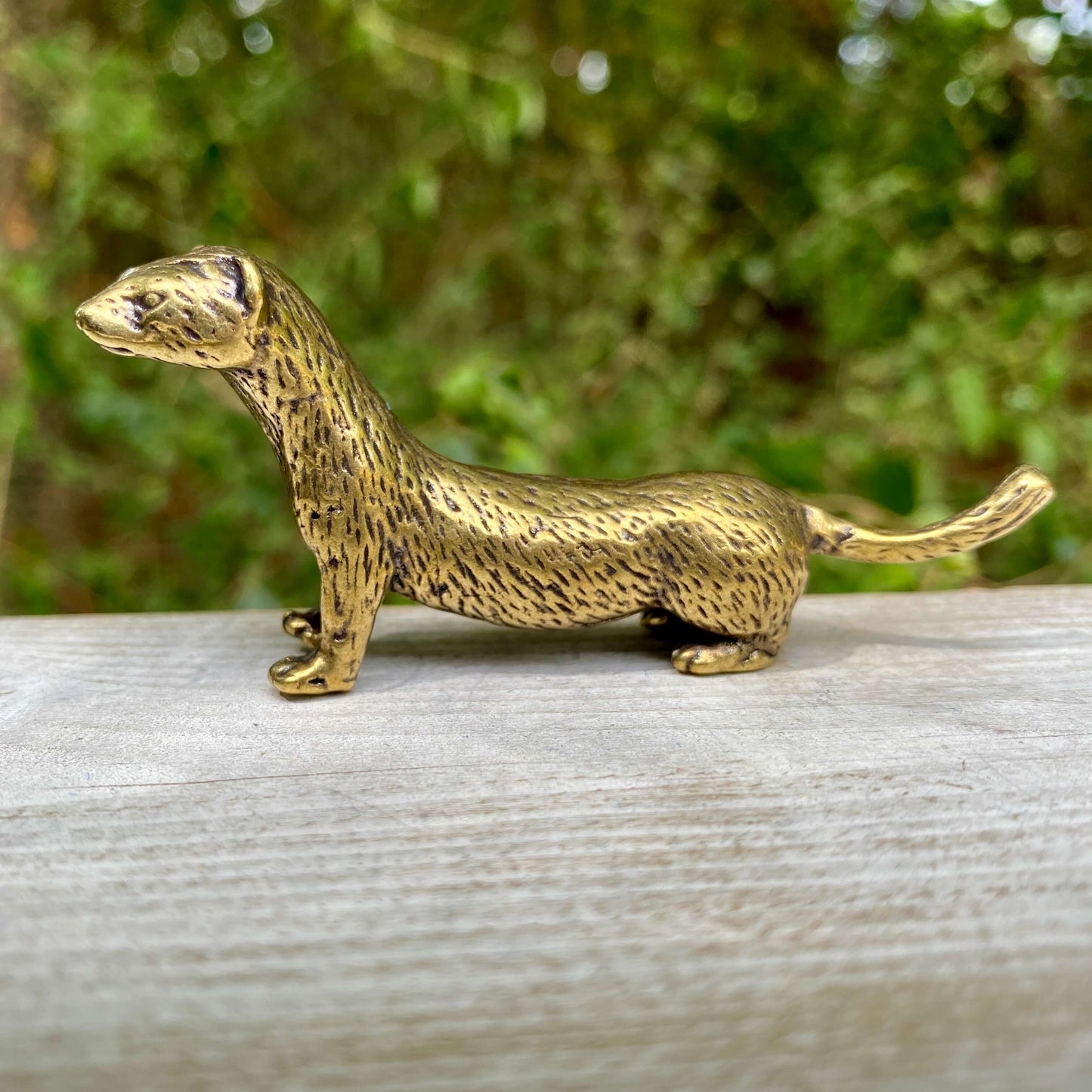 Solid brass weasel figurine by Wild Brass, showcasing a sleek, detailed weasel symbolizing cunning and agility.