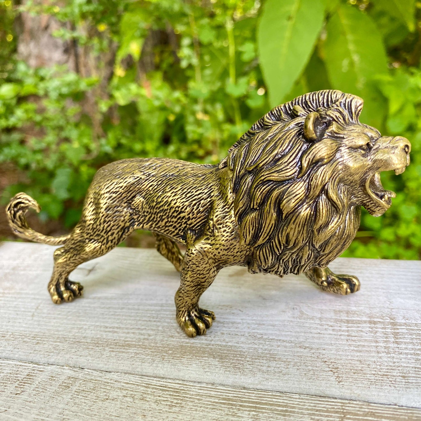 Solid brass lion sculpture by Wild Brass, symbol of courage, leadership, and strength, showcasing detailed craftsmanship.