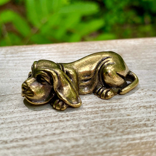 Solid brass Basset Hound figurine by Wild Brass, showcasing a detailed loyal and calm dog sculpture with a smooth finish.