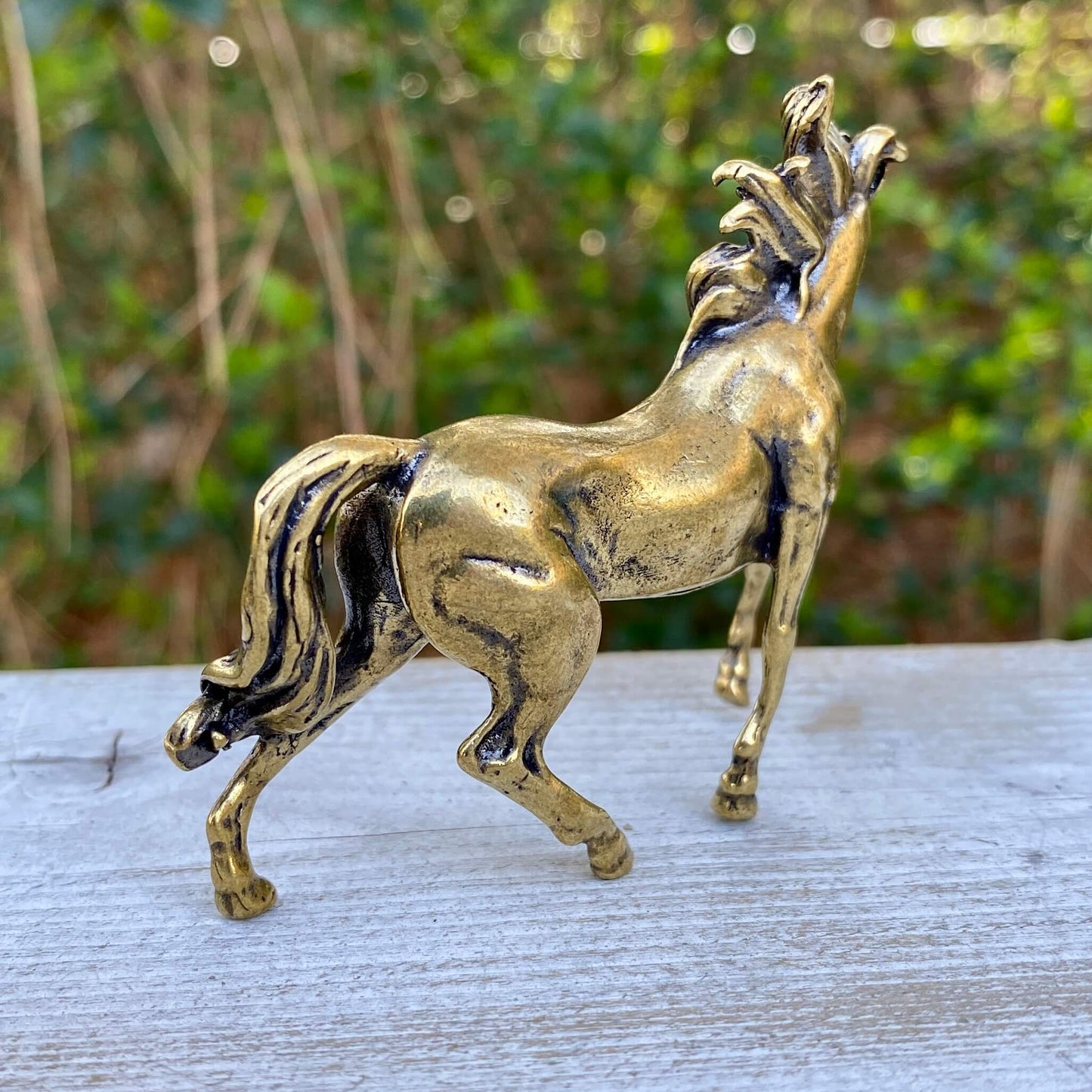 Solid brass horse stallion sculpture by Wild Brass, depicting a powerful and graceful stallion symbolizing freedom and strength.