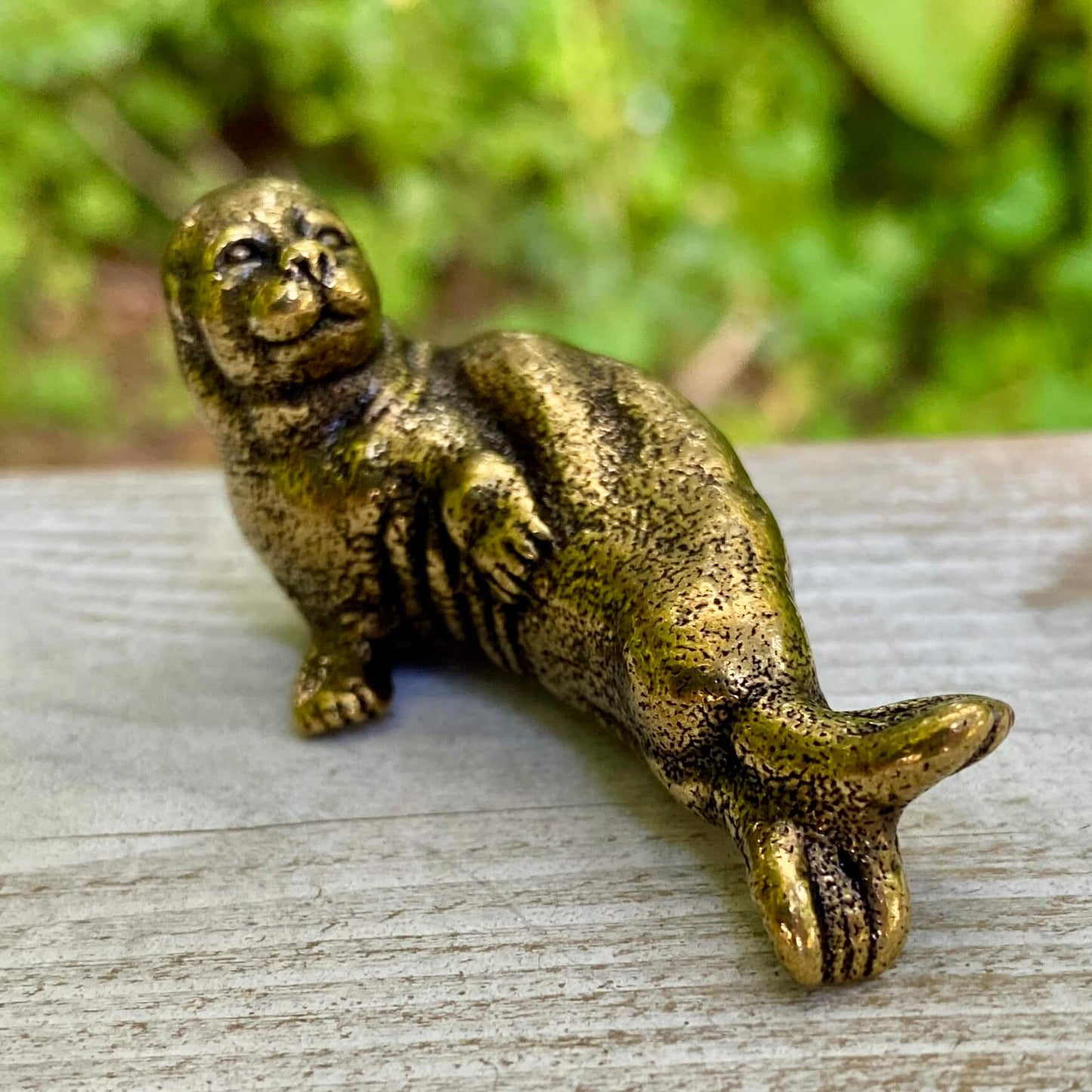 Solid brass walrus sculpture by Wild Brass, symbol of wisdom, strength, and community, featuring detailed craftsmanship and a polished finish.