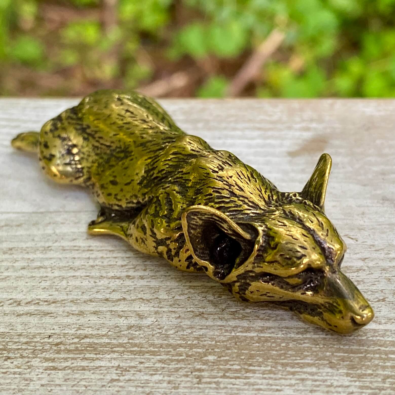 Solid brass Corgi dog figurine by Wild Brass, showcasing a playful, joyful pose symbolizing loyalty and cheerful spirit.