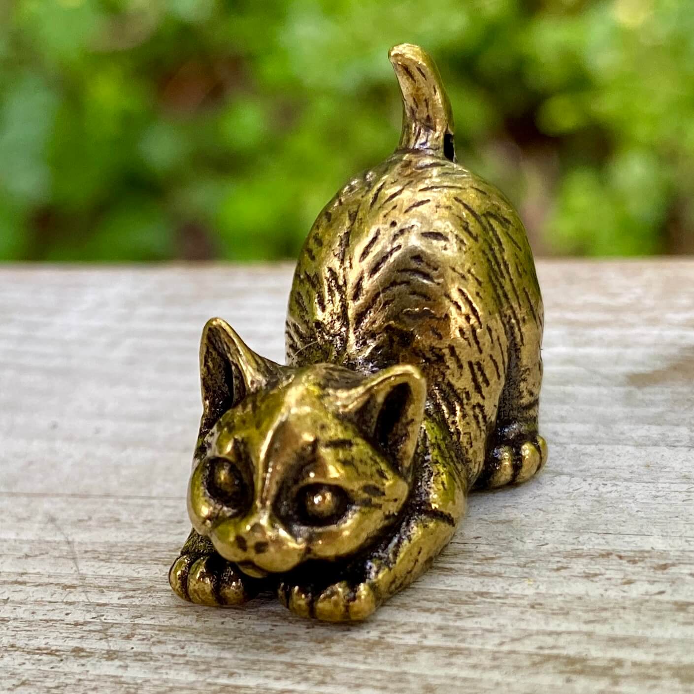 Solid brass cat figurine by Wild Brass, symbol of independence, mystery, and intuition, showcasing a sleek, detailed feline sculpture.