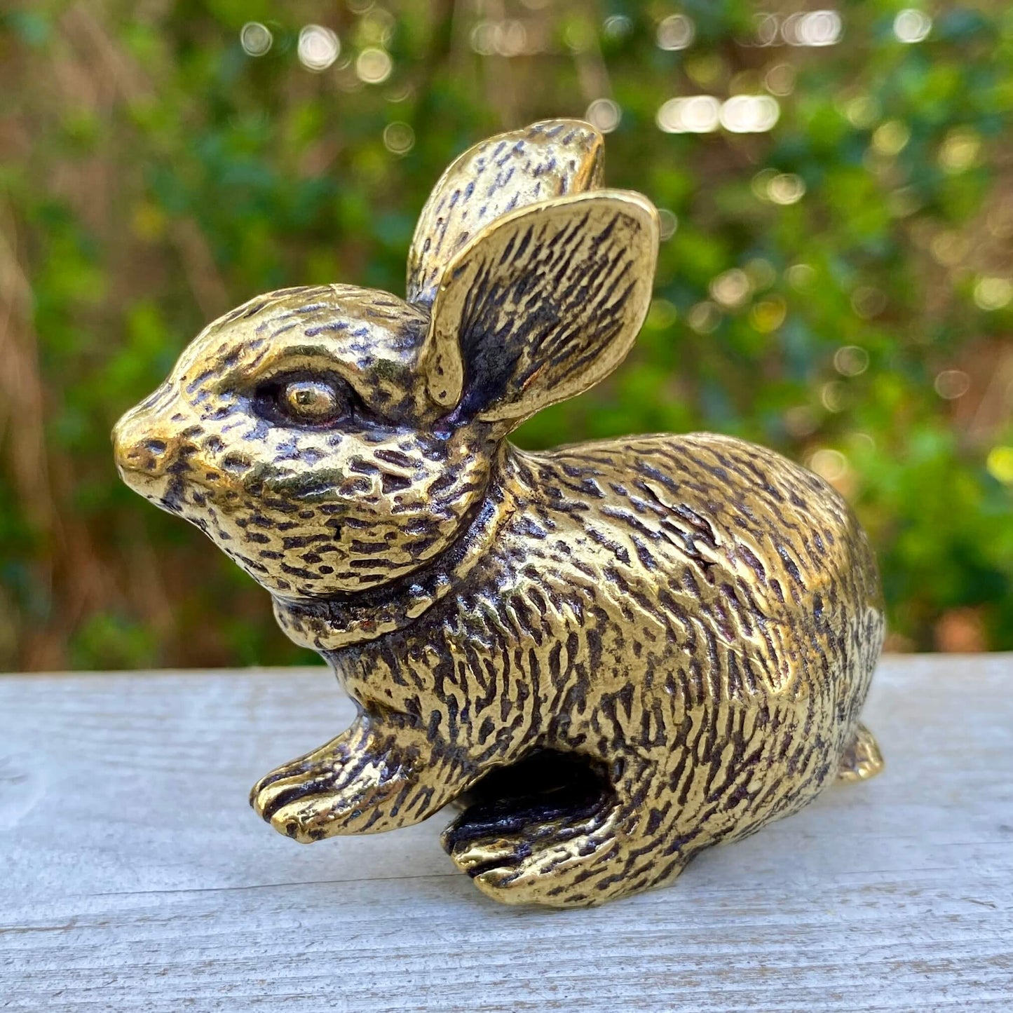 Solid brass rabbit figurine by Wild Brass, showcasing a smooth, polished bunny symbol of gentleness and good fortune.