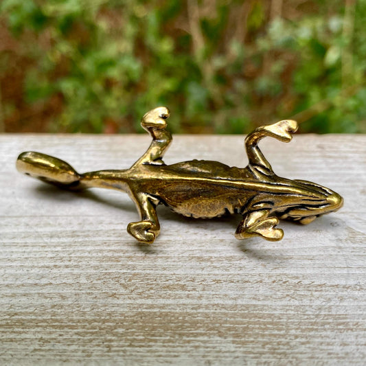Solid brass chameleon figurine by Wild Brass, symbolizing adaptability and change, with detailed craftsmanship and a smooth finish.