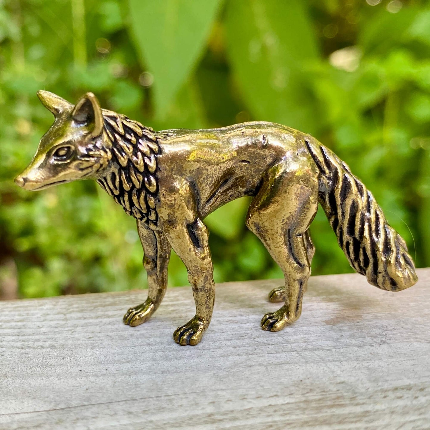 Solid brass fox figurine from Wild Brass, symbol of cleverness, adaptability, and trickery, detailed with a polished finish.