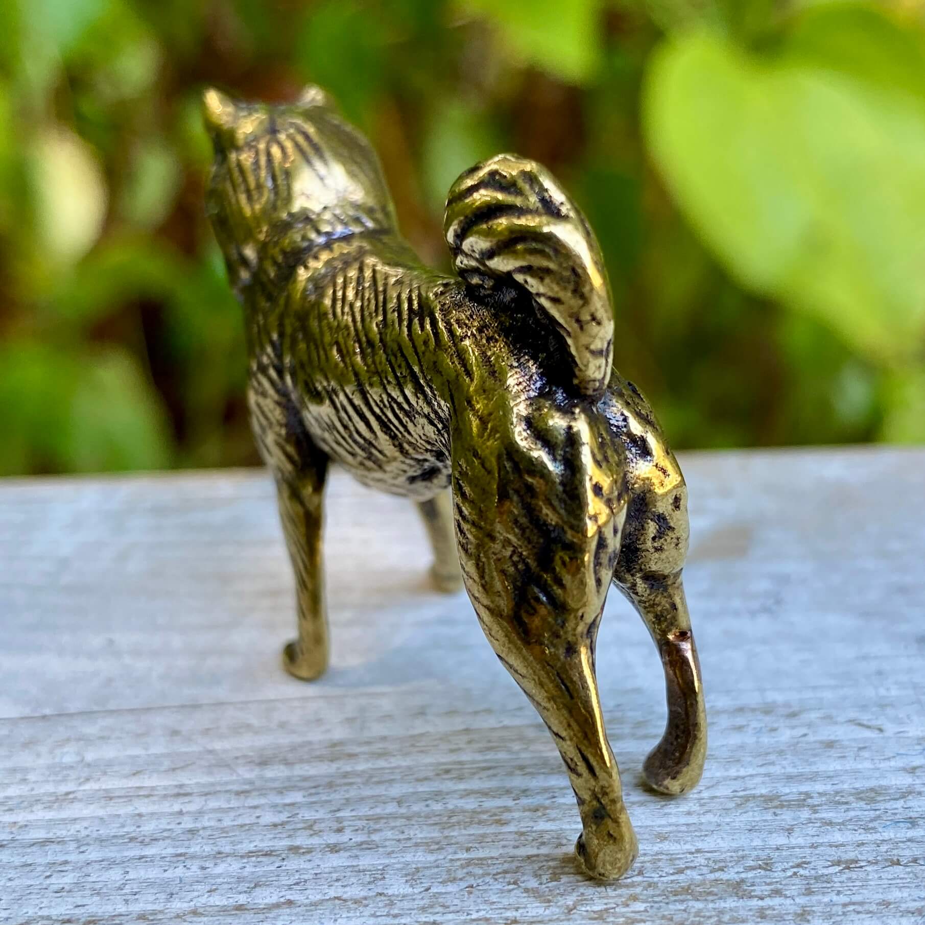 Solid brass Shiba Inu dog figurine by Wild Brass, symbol of loyalty, courage, and independence, with detailed craftsmanship.