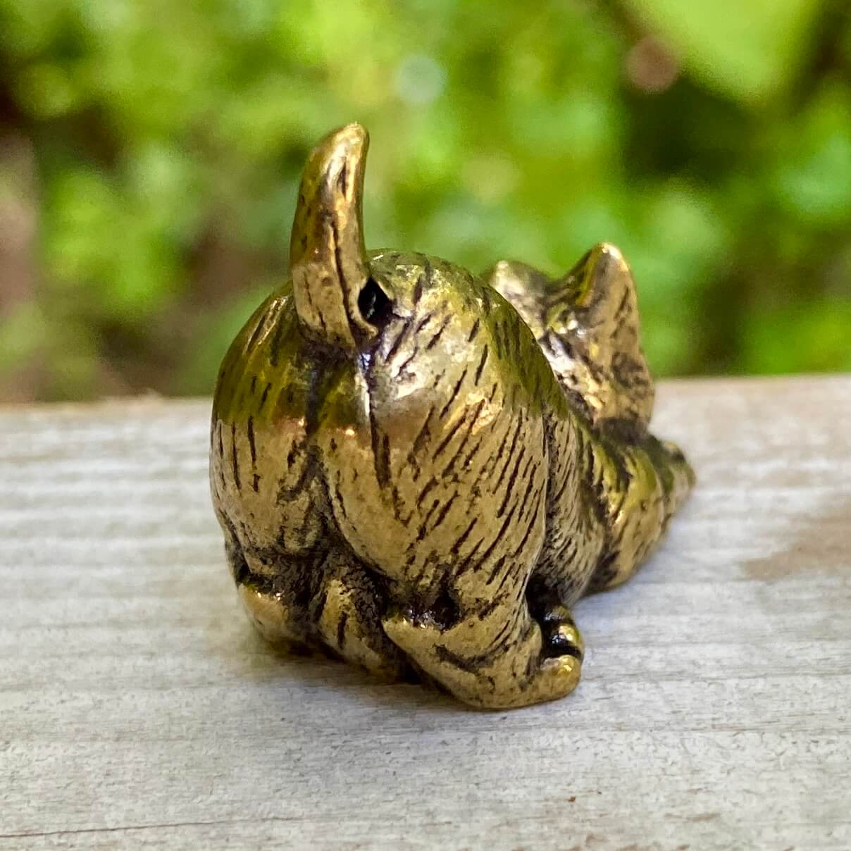Solid brass cat sculpture by Wild Brass, showcasing a sleek feline figure symbolizing independence, mystery, and intuition.