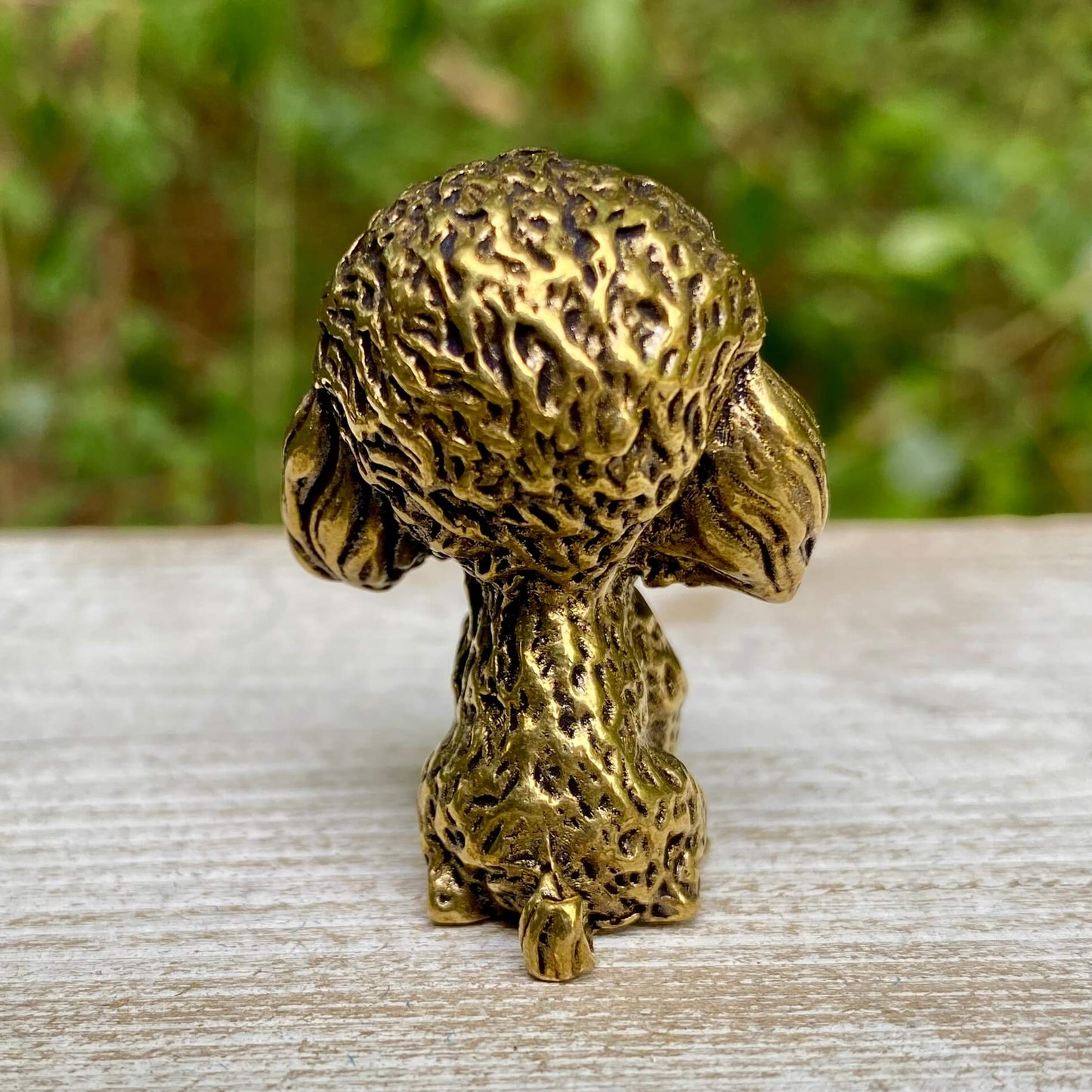 Solid brass poodle figurine by Wild Brass, showcasing an elegant, detailed dog sculpture symbolizing intelligence and loyalty.