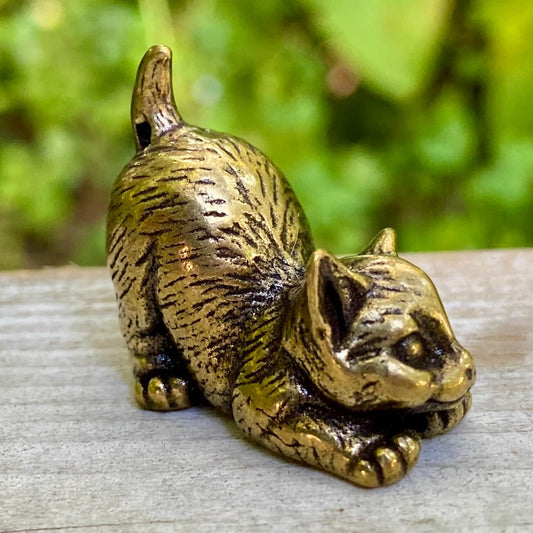 Solid brass cat sculpture by Wild Brass, symbol of independence, mystery, and intuition, with detailed feline features.