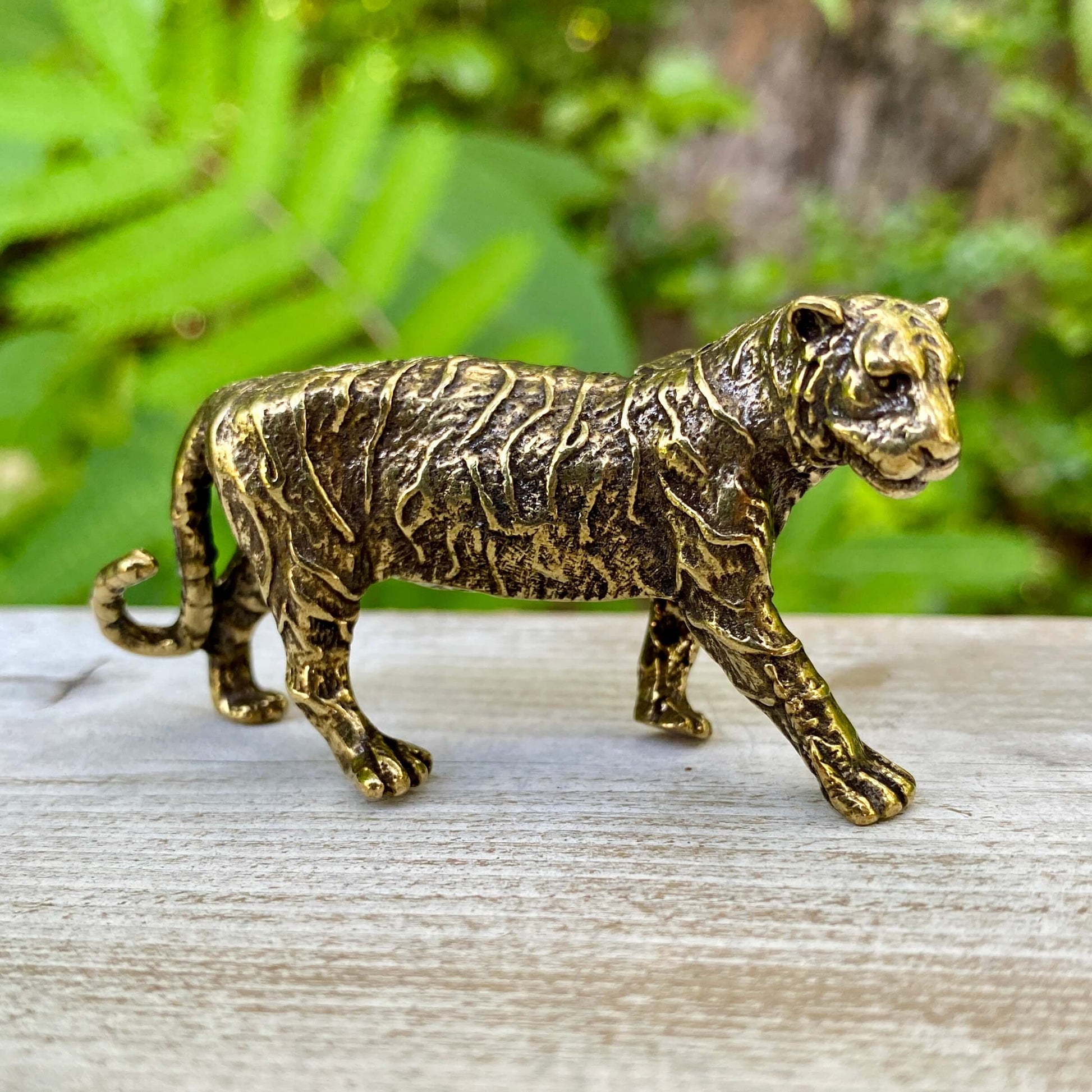 Solid brass tiger sculpture by Wild Brass, symbol of power, passion, and independence, displayed with detailed craftsmanship.