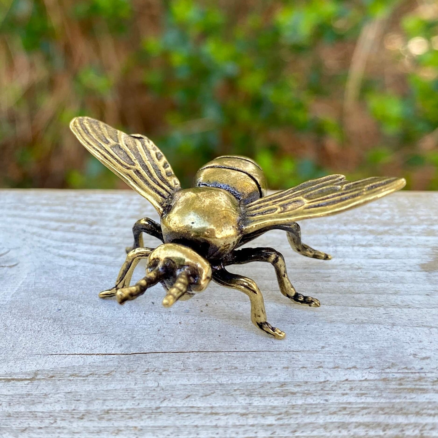 Solid brass bee sculpture by Wild Brass, symbol of harmony, beauty, and purpose, showcasing detailed craftsmanship.
