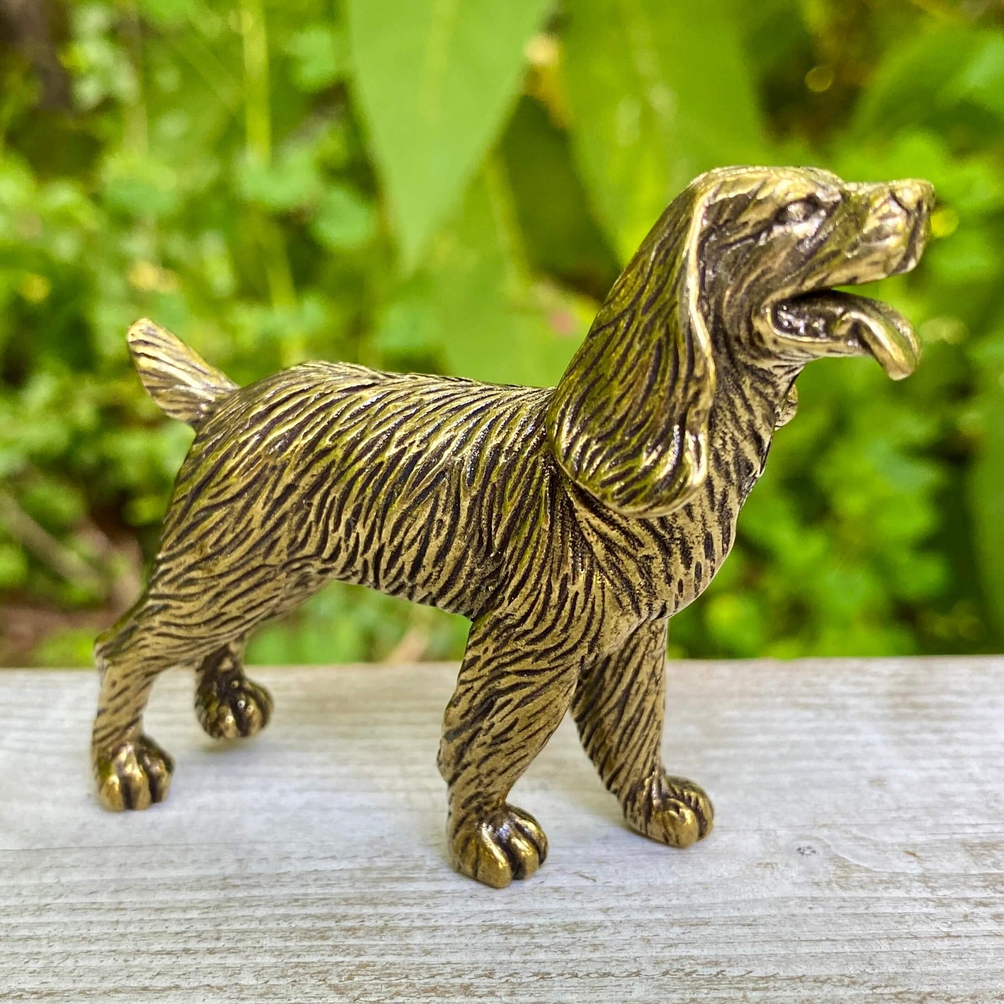 Solid brass cocker spaniel figurine by Wild Brass, showcasing a detailed, gentle-looking dog symbolizing devotion and affection.