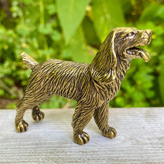 Solid brass cocker spaniel figurine by Wild Brass, showcasing a detailed, gentle-looking dog symbolizing devotion and affection.