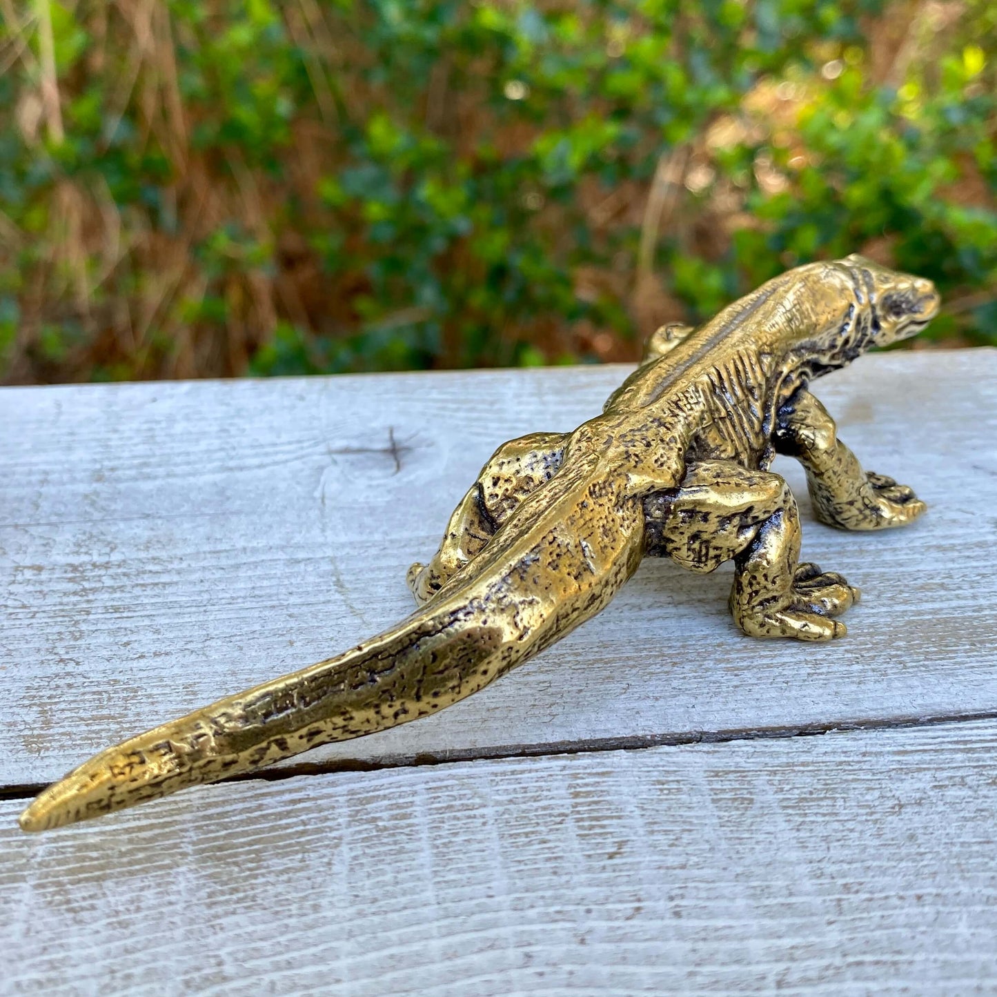 Solid brass Komodo dragon sculpture by Wild Brass, symbol of strength, wisdom, and instinct, detailed and polished.