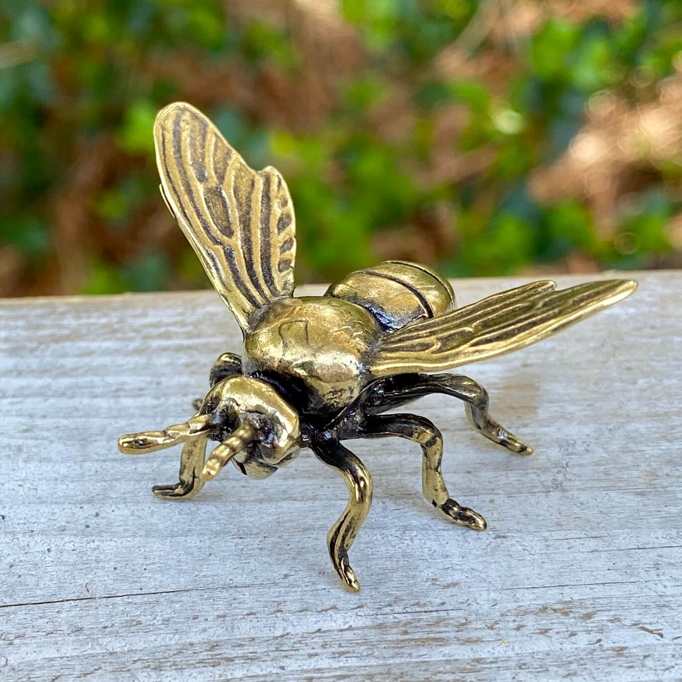 Solid brass bee symbol from Wild Brass, representing harmony, beauty, and purpose, with detailed craftsmanship and a polished finish.