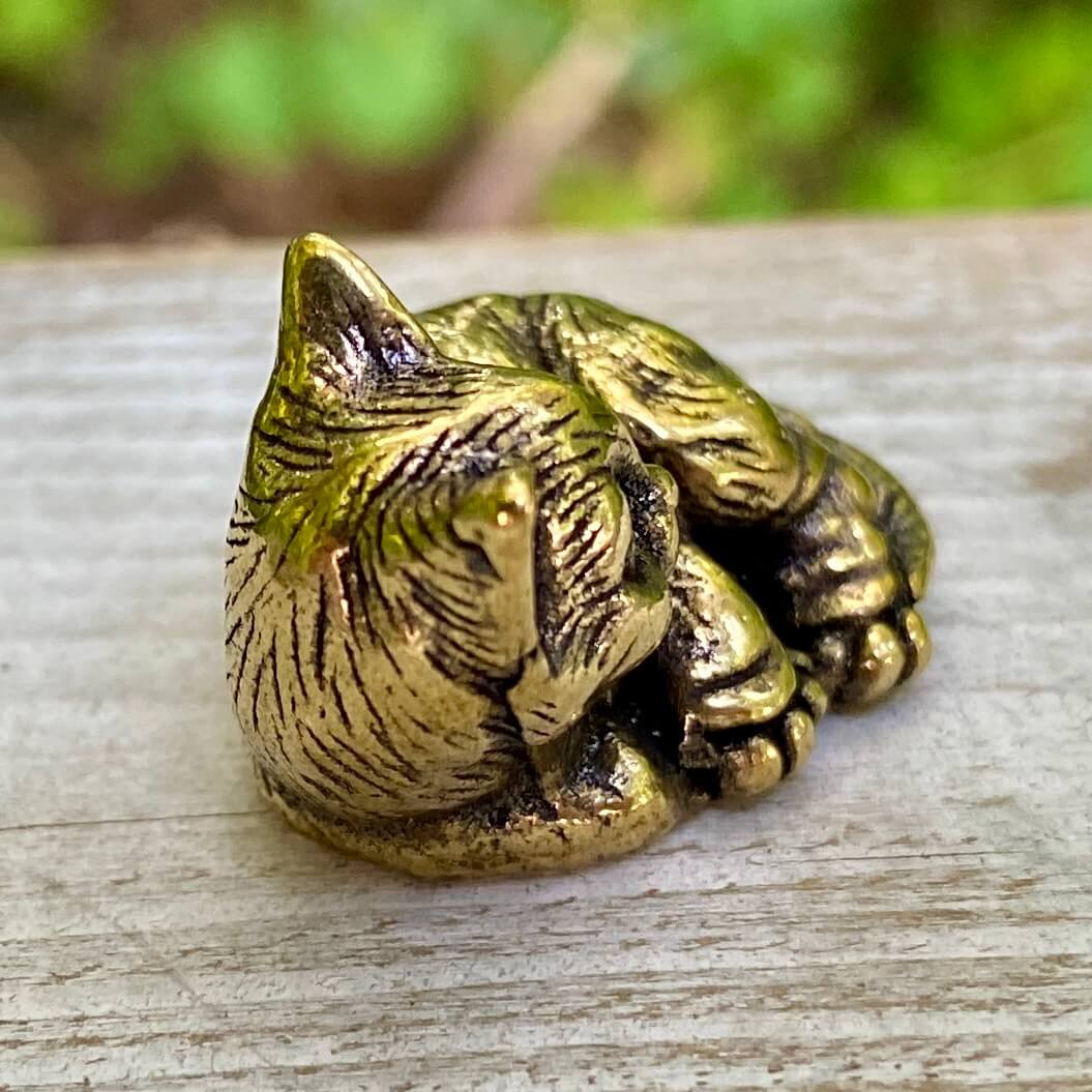 Solid brass cat figurine by Wild Brass, showcasing an elegant feline with a sleek, polished finish and detailed features.