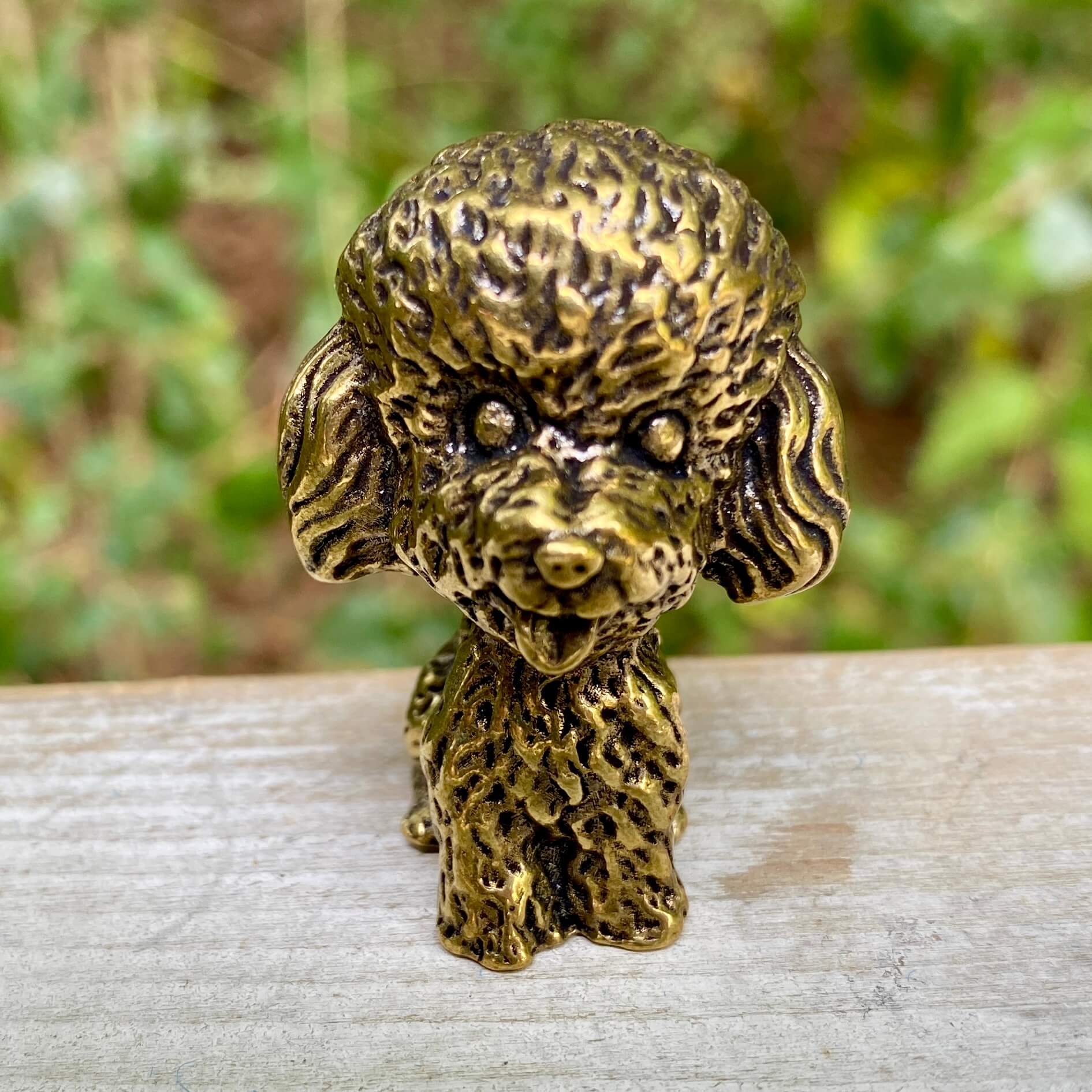 Solid brass poodle sculpture by Wild Brass, showcasing an elegant, detailed poodle figure symbolizing intelligence and loyalty.