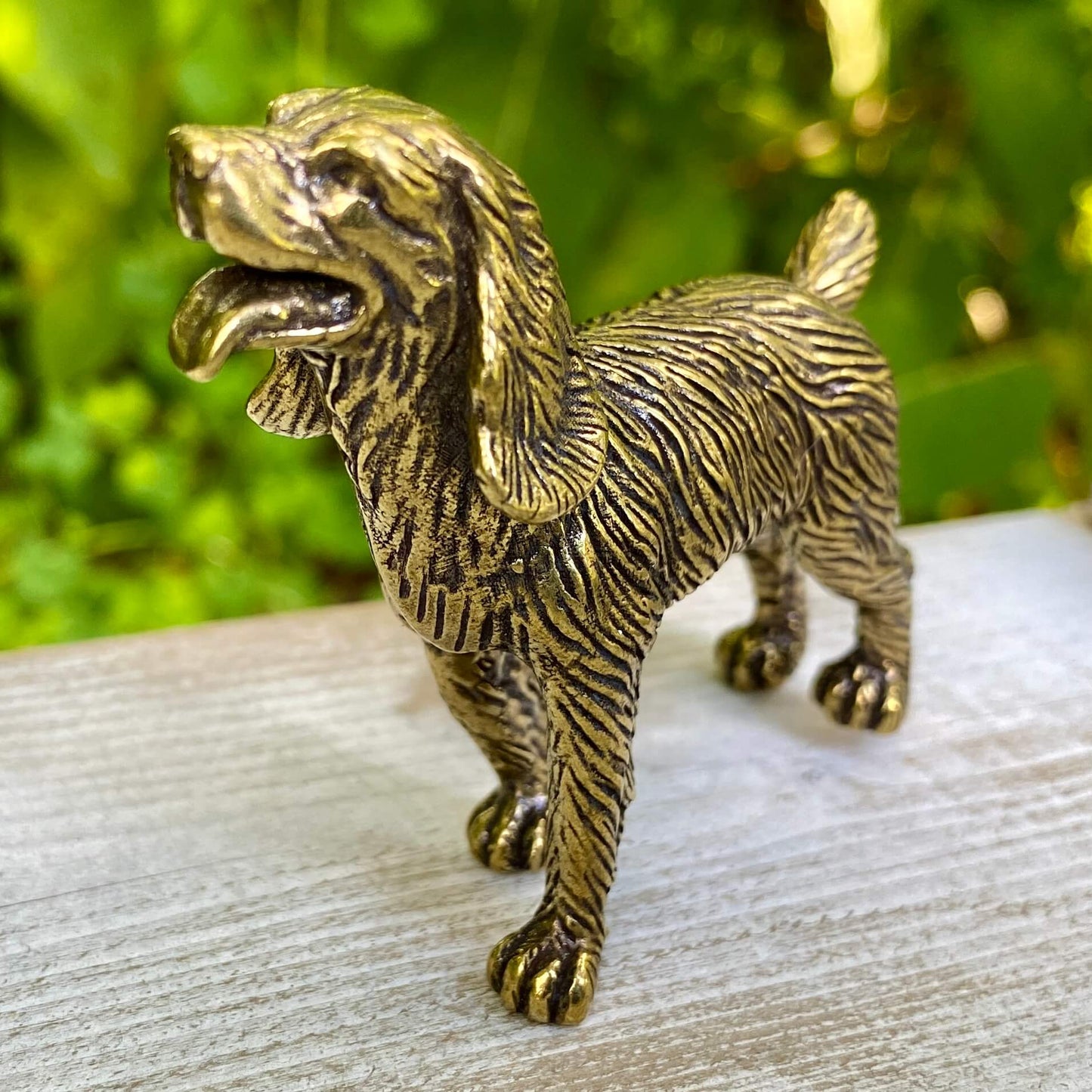 Solid brass cocker spaniel figurine by Wild Brass, showcasing detailed craftsmanship and a gentle, affectionate pose.