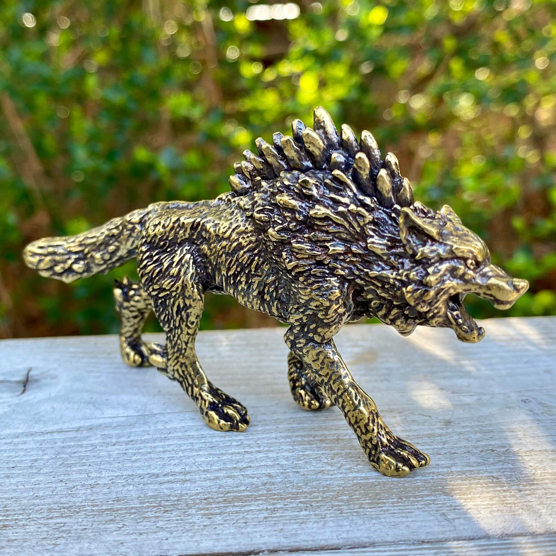 Solid brass Wolverine figurine by Wild Brass, symbol of independence, survival, and untamed spirit, with detailed 3D craftsmanship.