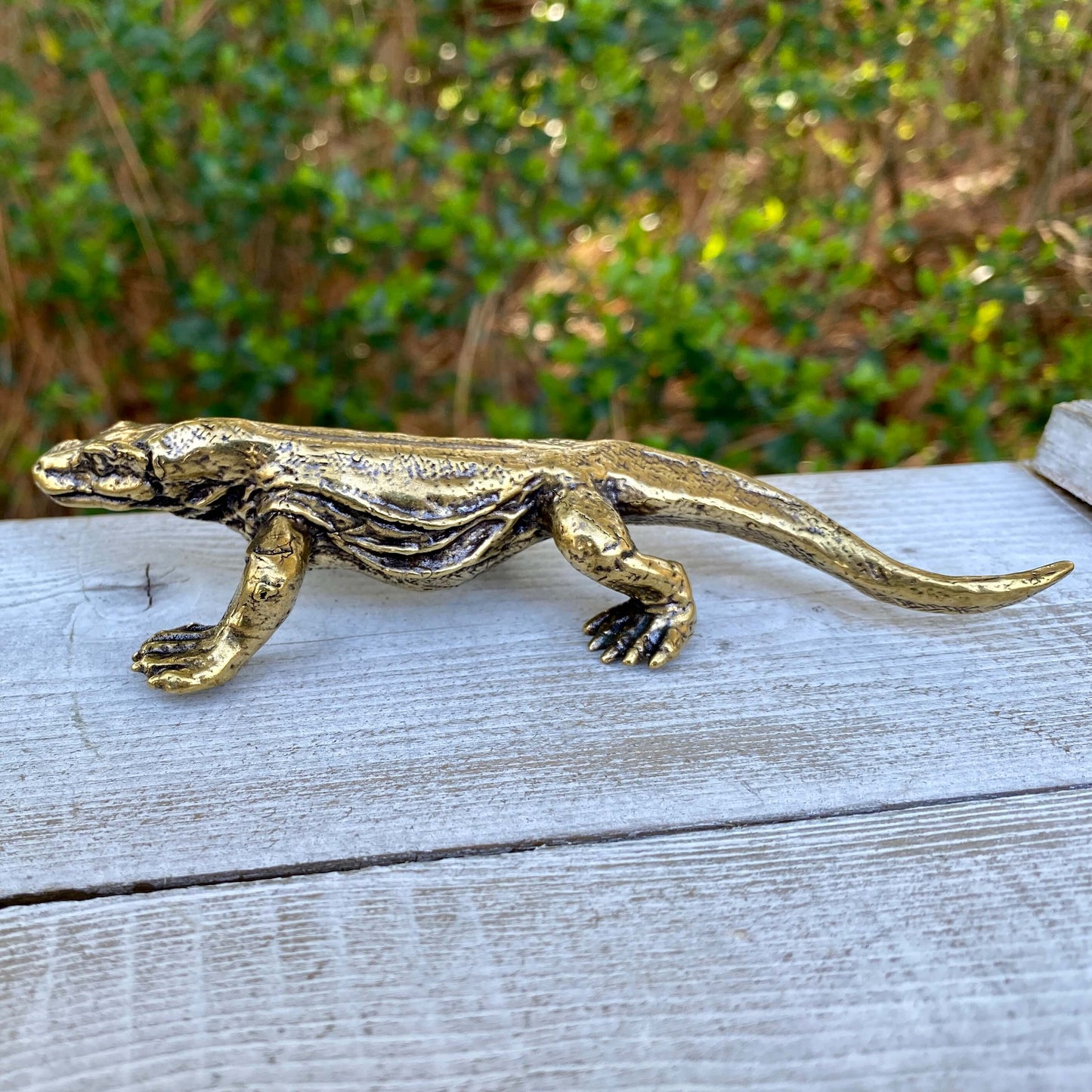 Solid brass Komodo dragon figurine by Wild Brass, showcasing intricate details of the lizard symbolizing strength and wisdom.