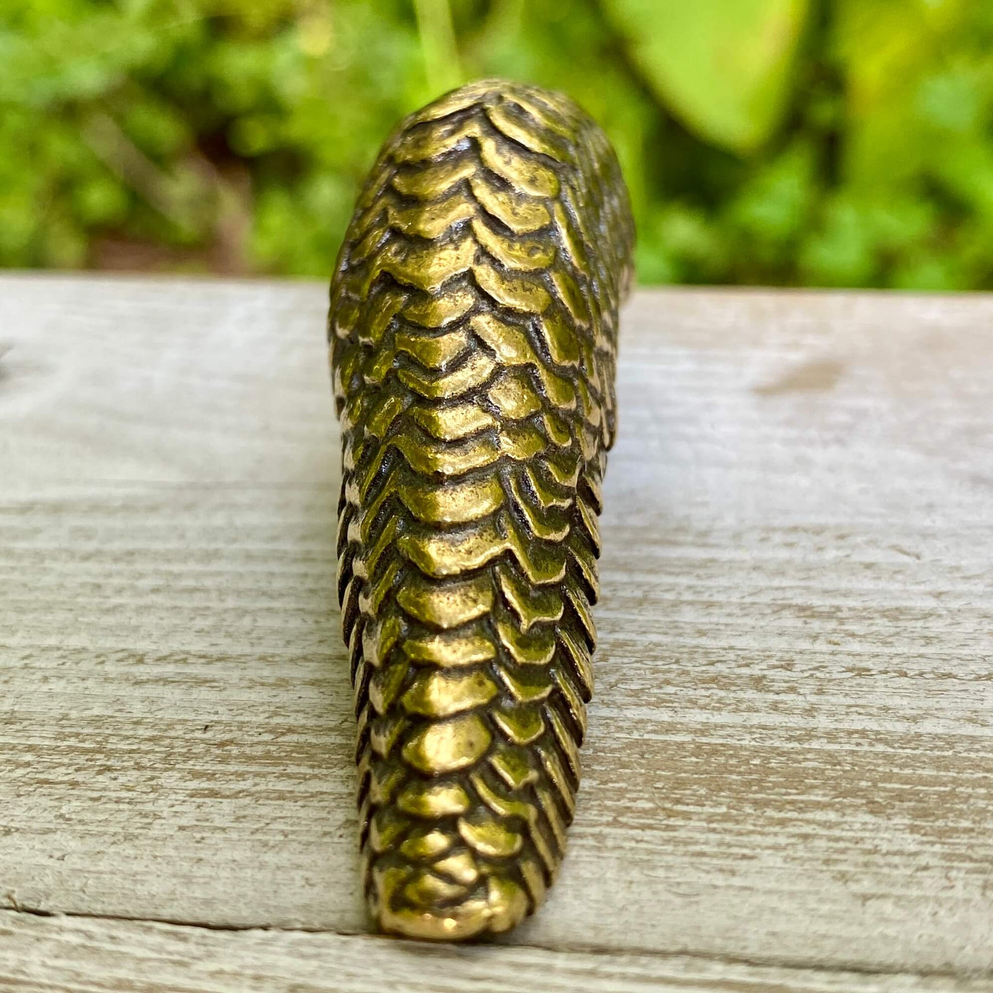 Solid brass pangolin sculpture by Wild Brass, symbolizing protection, patience, and transformation, with intricate details and a polished finish.