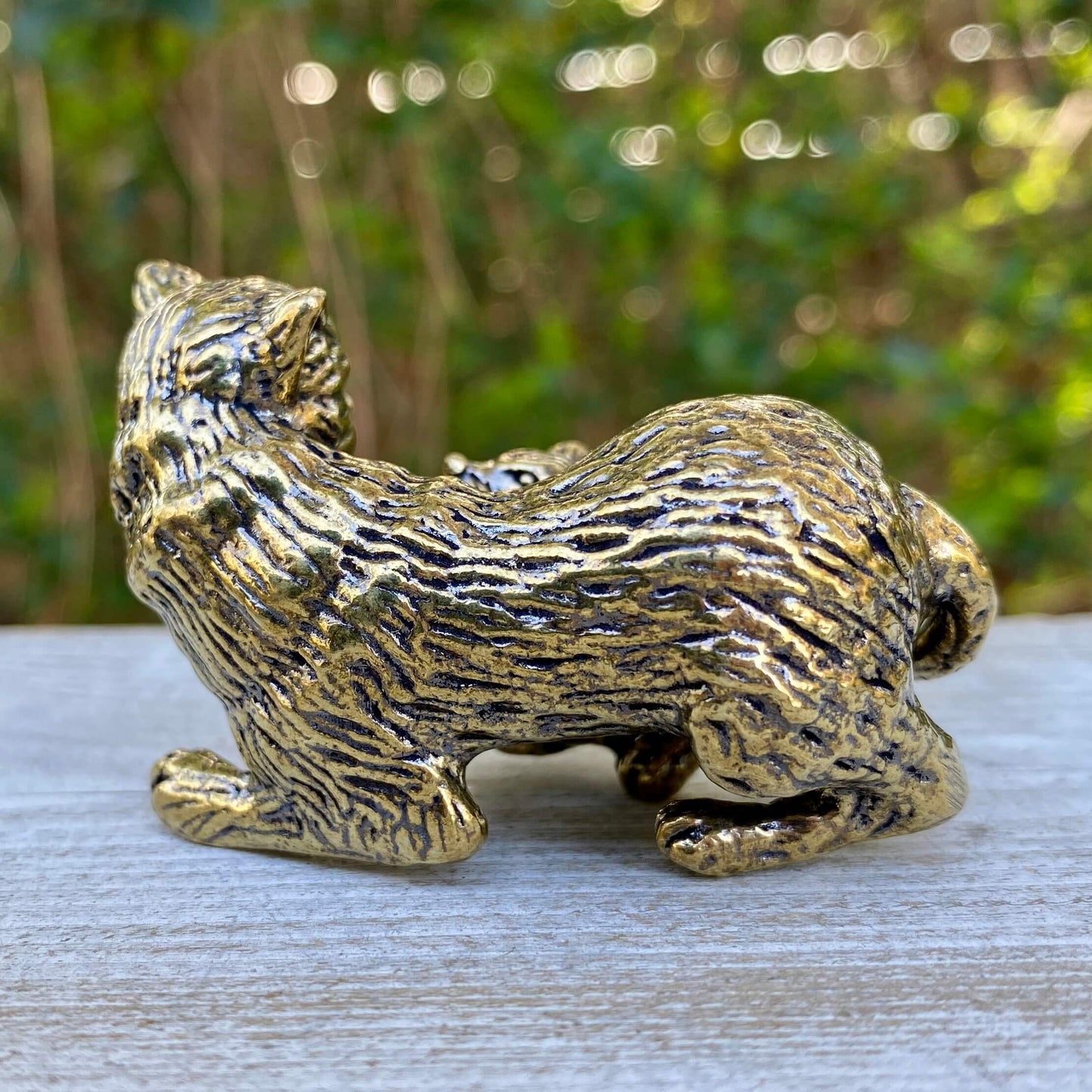 Solid brass cat and mouse figurines from Wild Brass, symbolizing balance, coexistence, and curiosity, displayed together.