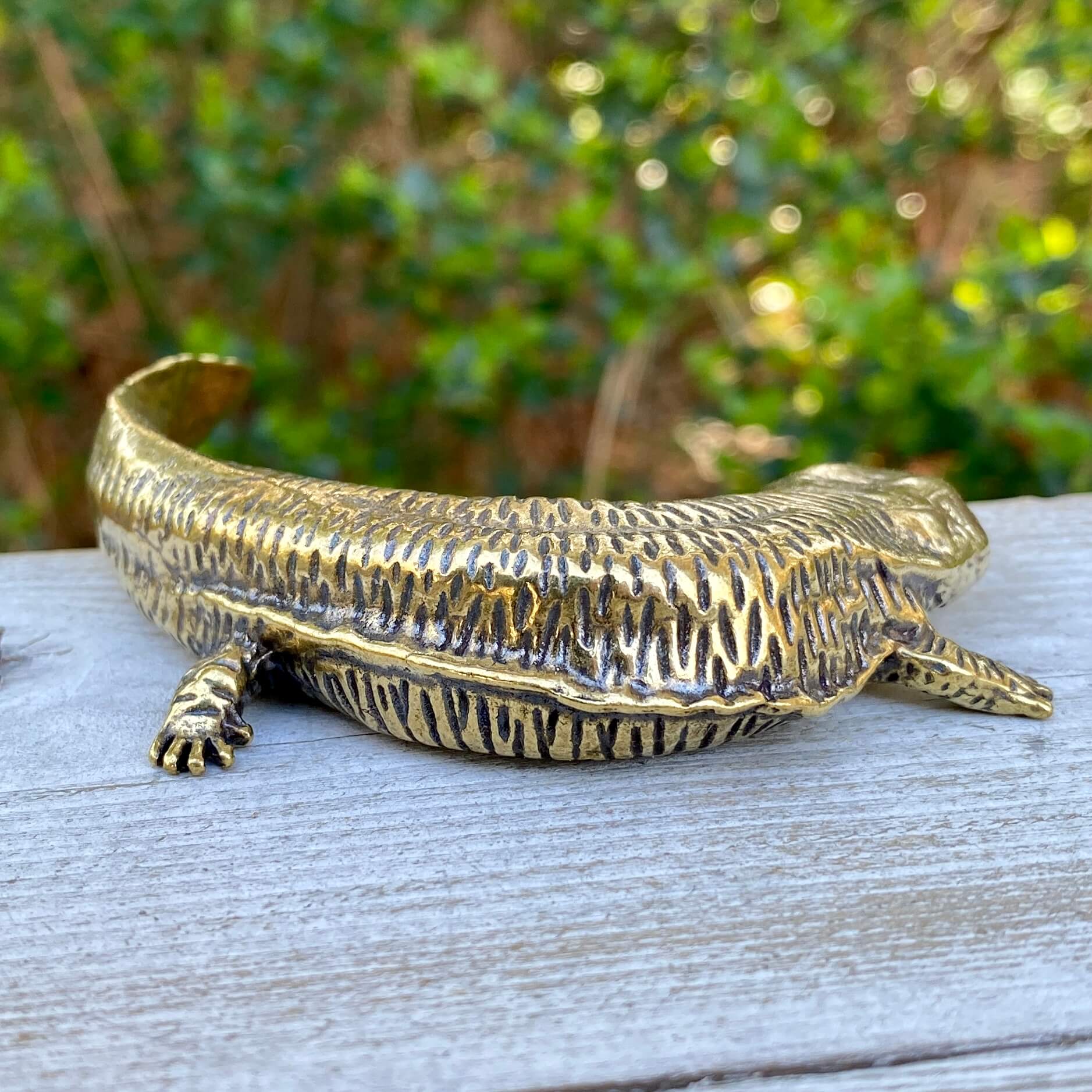 Solid brass salamander sculpture by Wild Brass, symbol of resilience and rebirth, featuring intricate details and a polished finish.