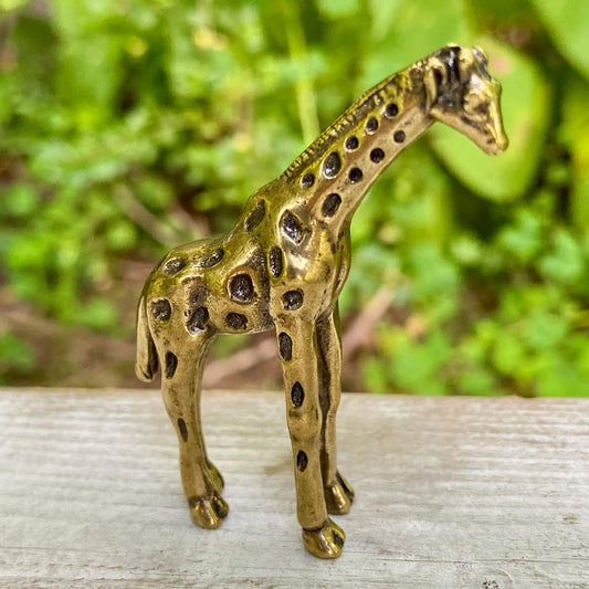 Solid brass giraffe sculpture by Wild Brass, symbol of intuition and power, featuring intricate details and a polished finish.