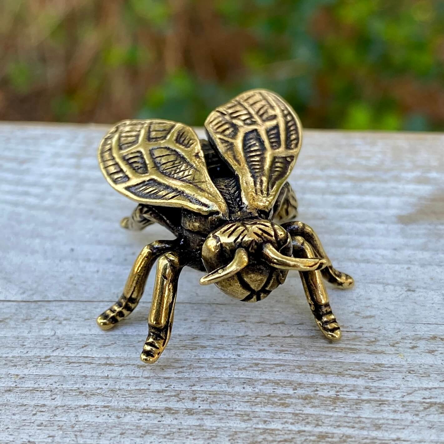 Solid brass wasp sculpture by Wild Brass, symbol of focus, precision, and discipline, showing intricate details of the wasp figure.