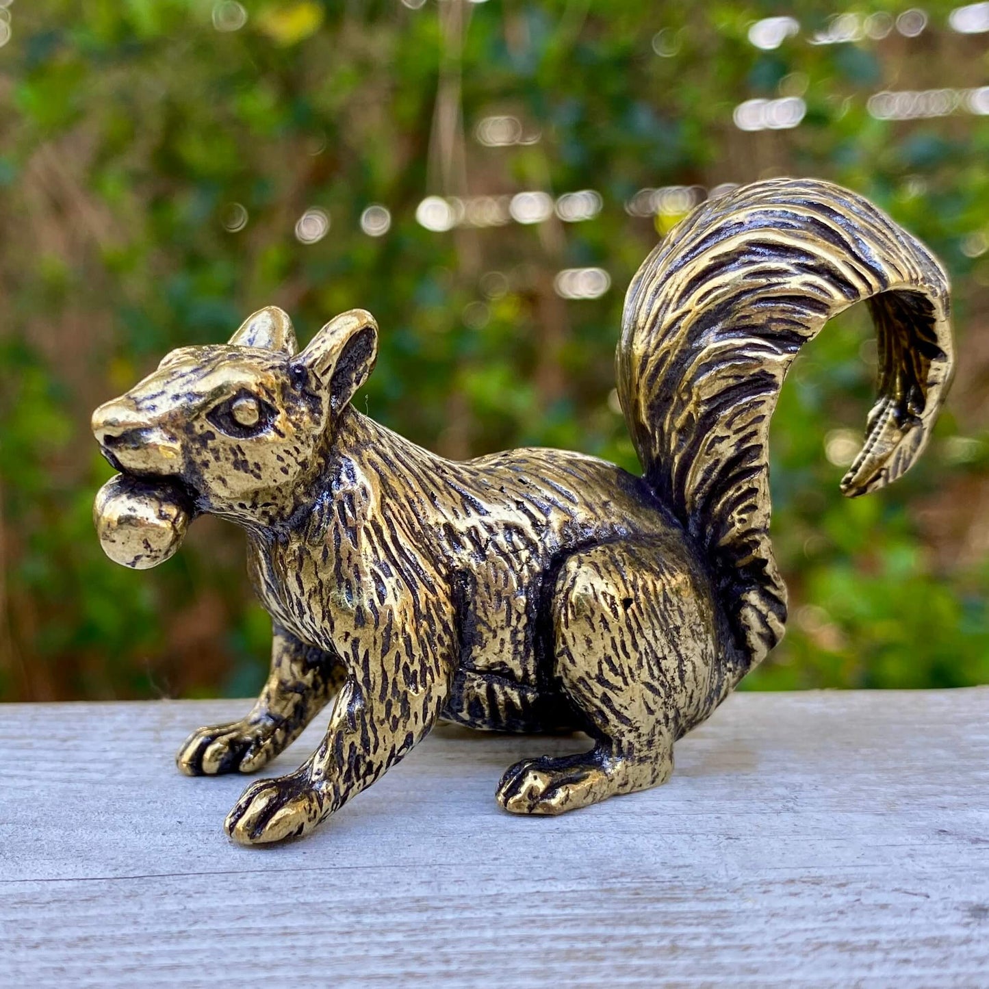 Solid brass squirrel figurine by Wild Brass, showcasing a playful squirrel with detailed features symbolizing curiosity and joy.