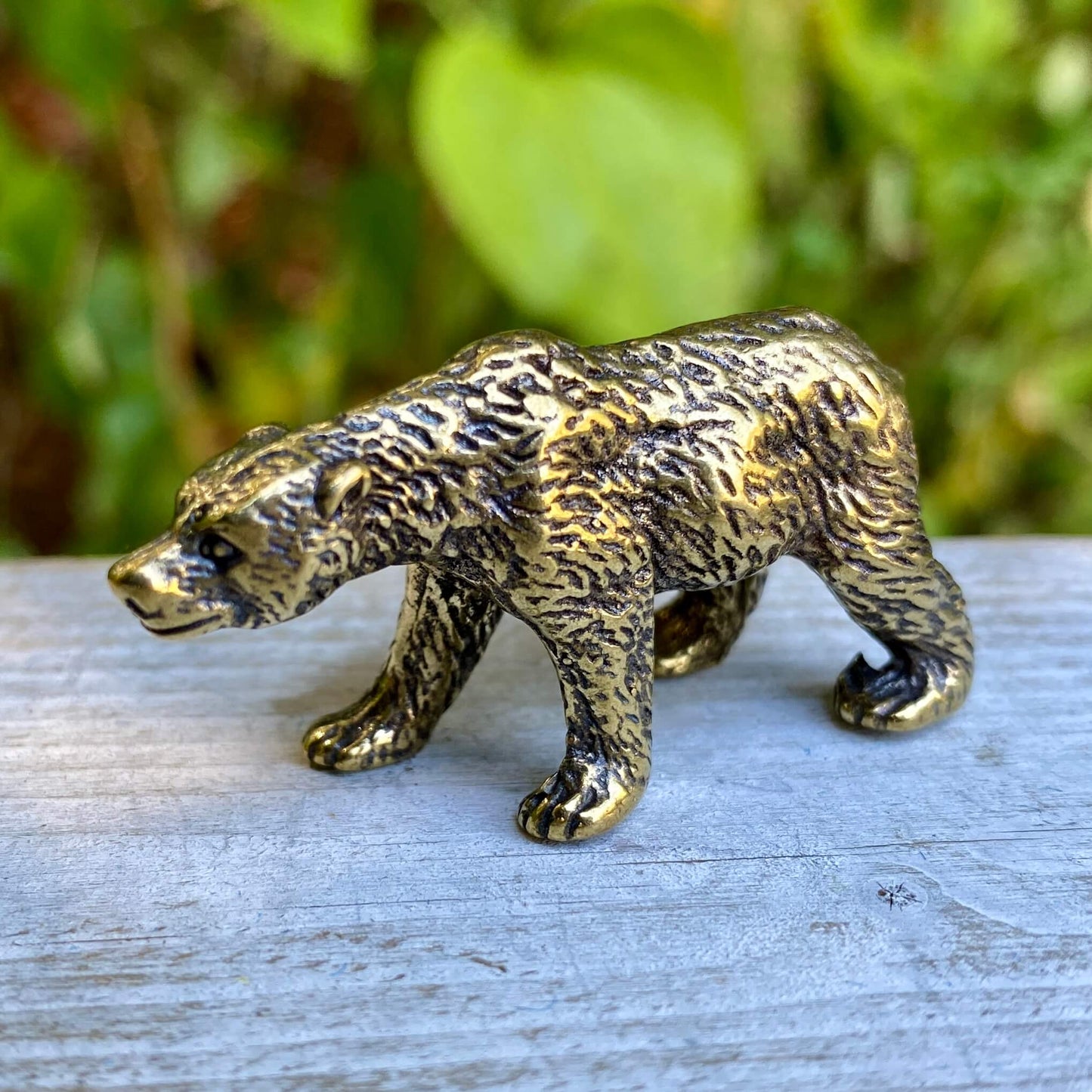 Solid brass bear figurine by Wild Brass, symbol of strength and protection, showcasing intricate craftsmanship and a powerful stance.