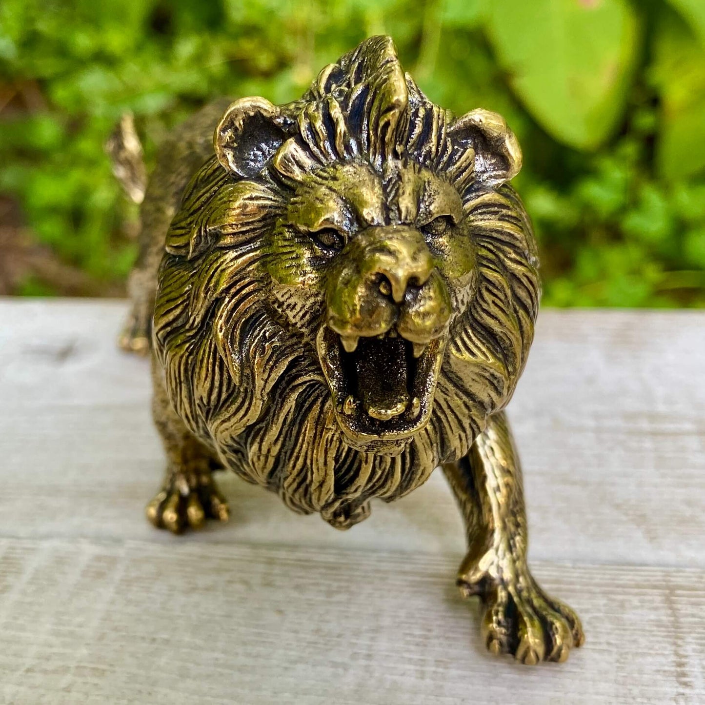 Solid brass lion sculpture by Wild Brass symbolizing courage, leadership, and strength, featuring a detailed lion figure with a polished finish.