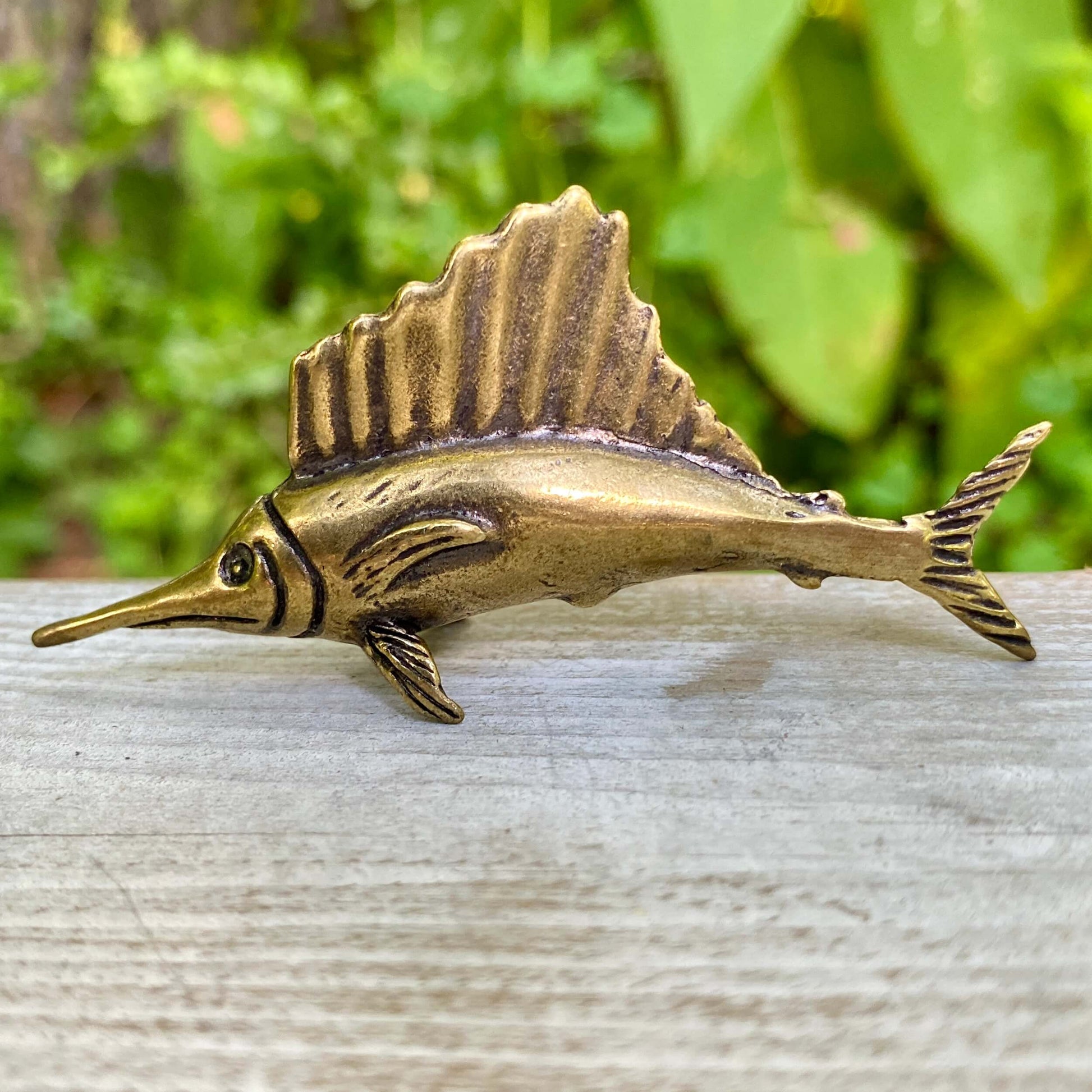 Solid brass marlin fish sculpture by Wild Brass, detailed nautical decor symbolizing speed, precision, and nobility.