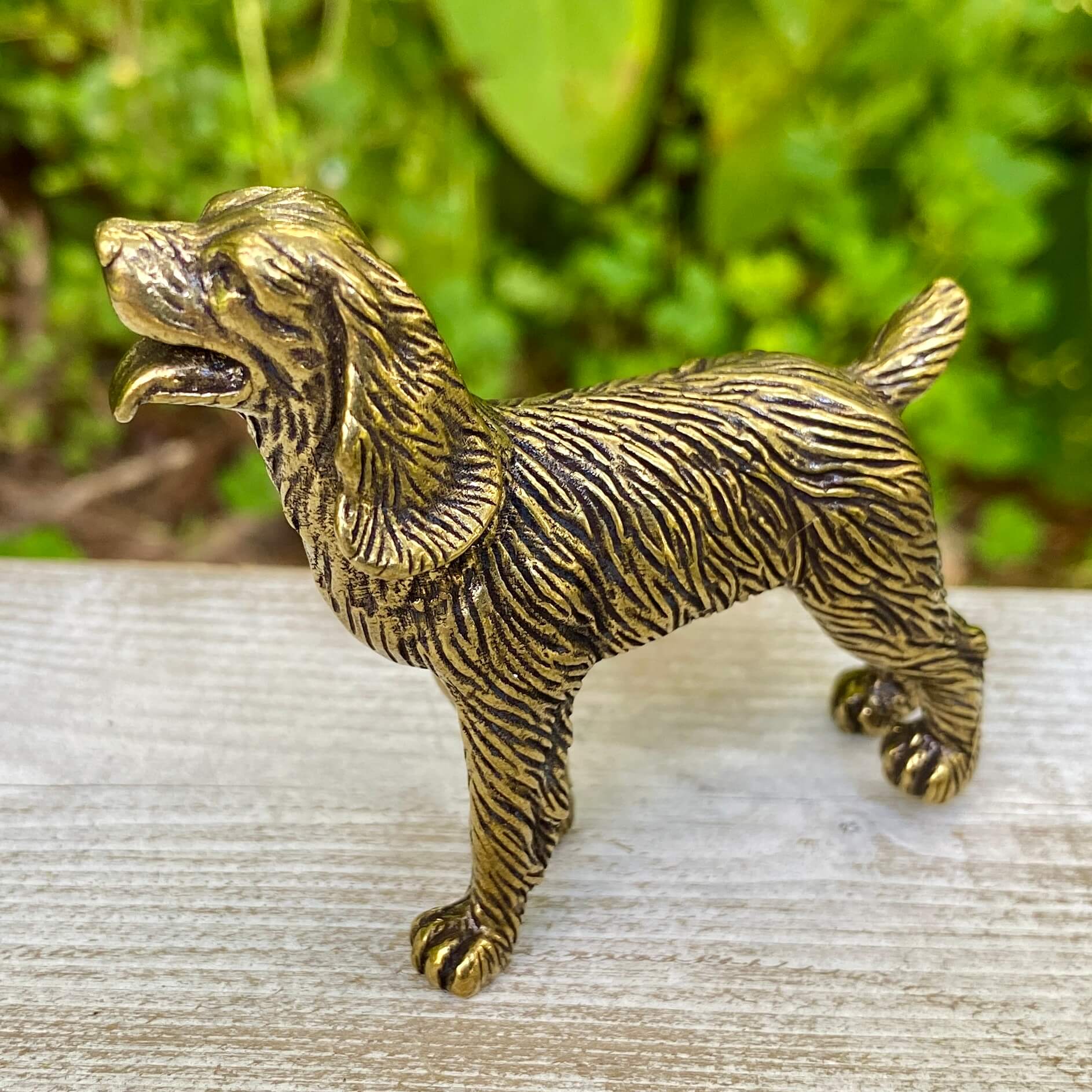 Solid brass cocker spaniel figurine by Wild Brass, showcasing a detailed, gentle dog sculpture symbolizing affection and devotion.