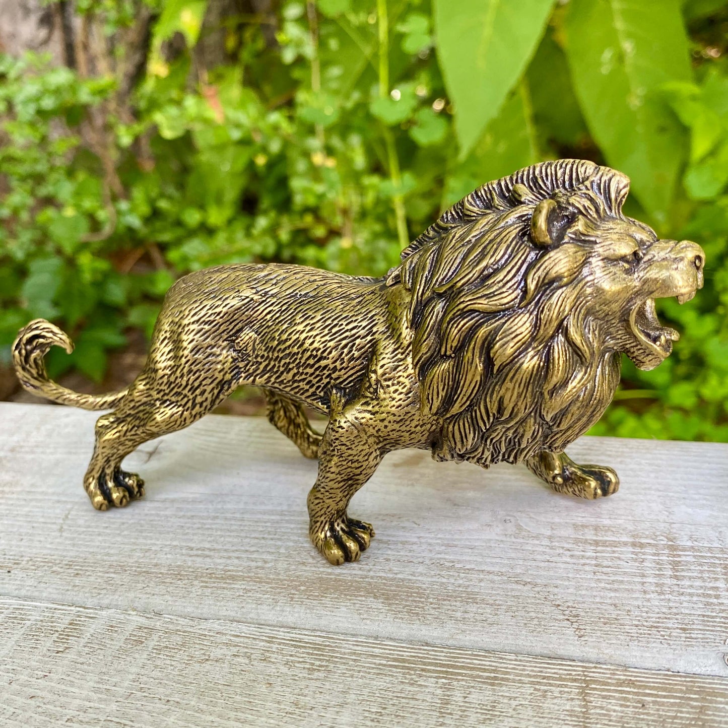 Solid brass lion figurine by Wild Brass, symbol of courage, leadership, and strength, with detailed craftsmanship and a regal stance.