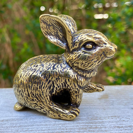 Solid brass rabbit figurine by Wild Brass, symbol of gentleness, abundance, and good fortune, shown in a detailed close-up image.