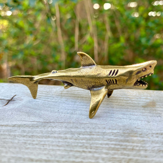 Solid brass shark figurine by Wild Brass, symbolizing power, agility, and strength, with detailed shark design.