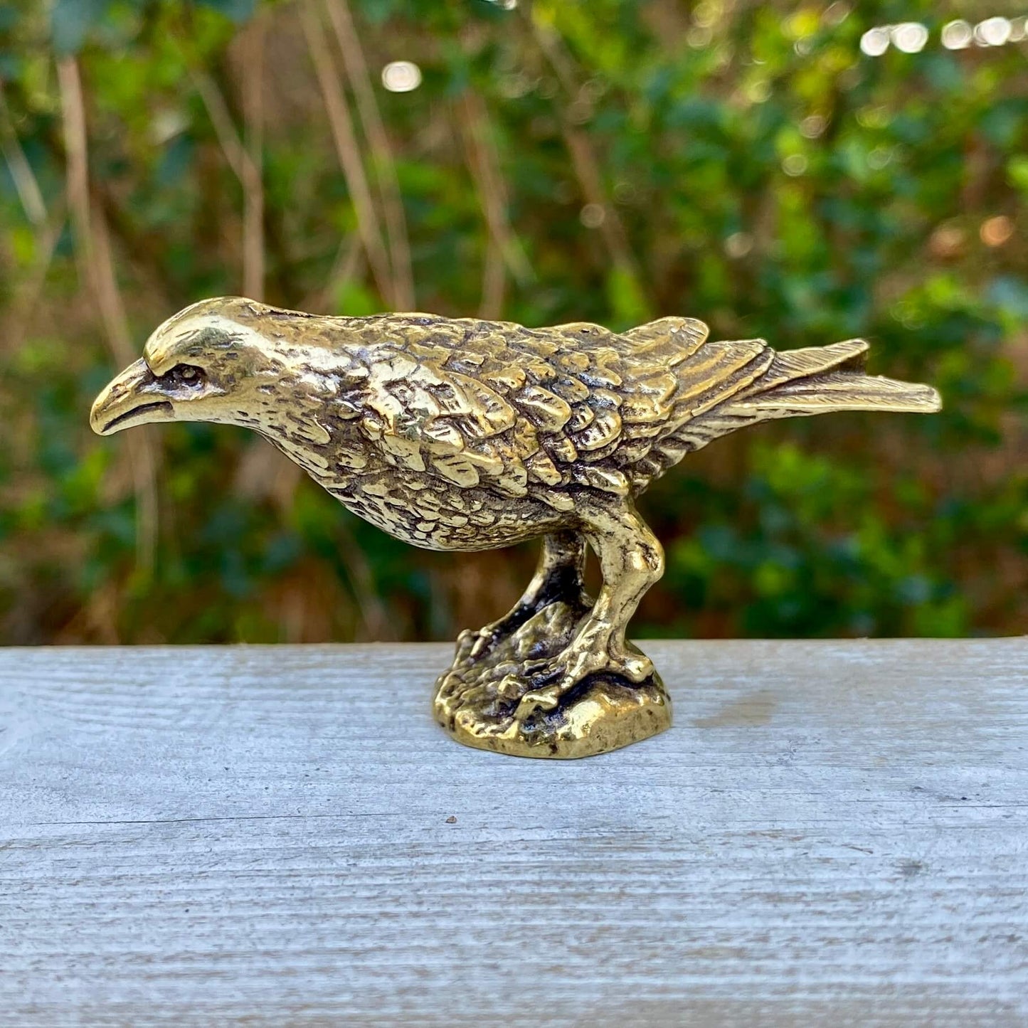 Solid brass raven sculpture by Wild Brass, symbol of intelligence, wisdom, and prophecy with detailed craftsmanship.