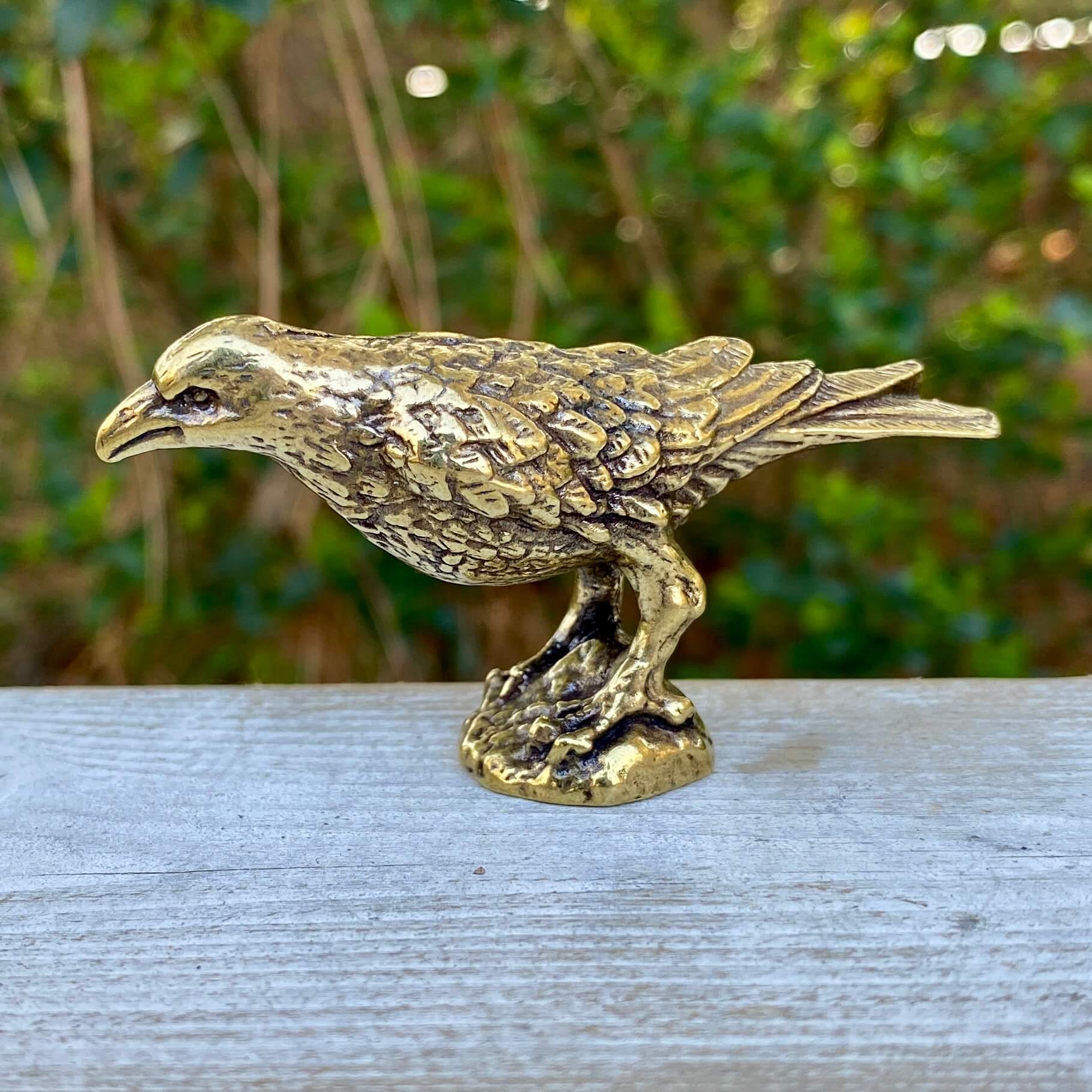 Solid brass raven sculpture by Wild Brass, symbol of intelligence, wisdom, and prophecy with detailed craftsmanship.