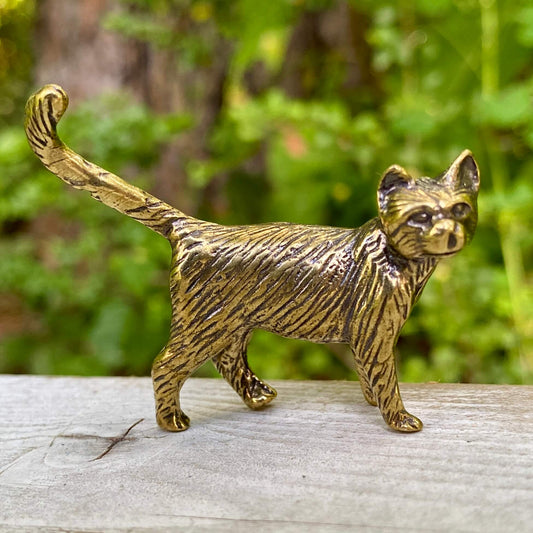 Solid brass cat sculpture by Wild Brass, symbolizing independence, mystery, and intuition, detailed with a sleek, polished finish.