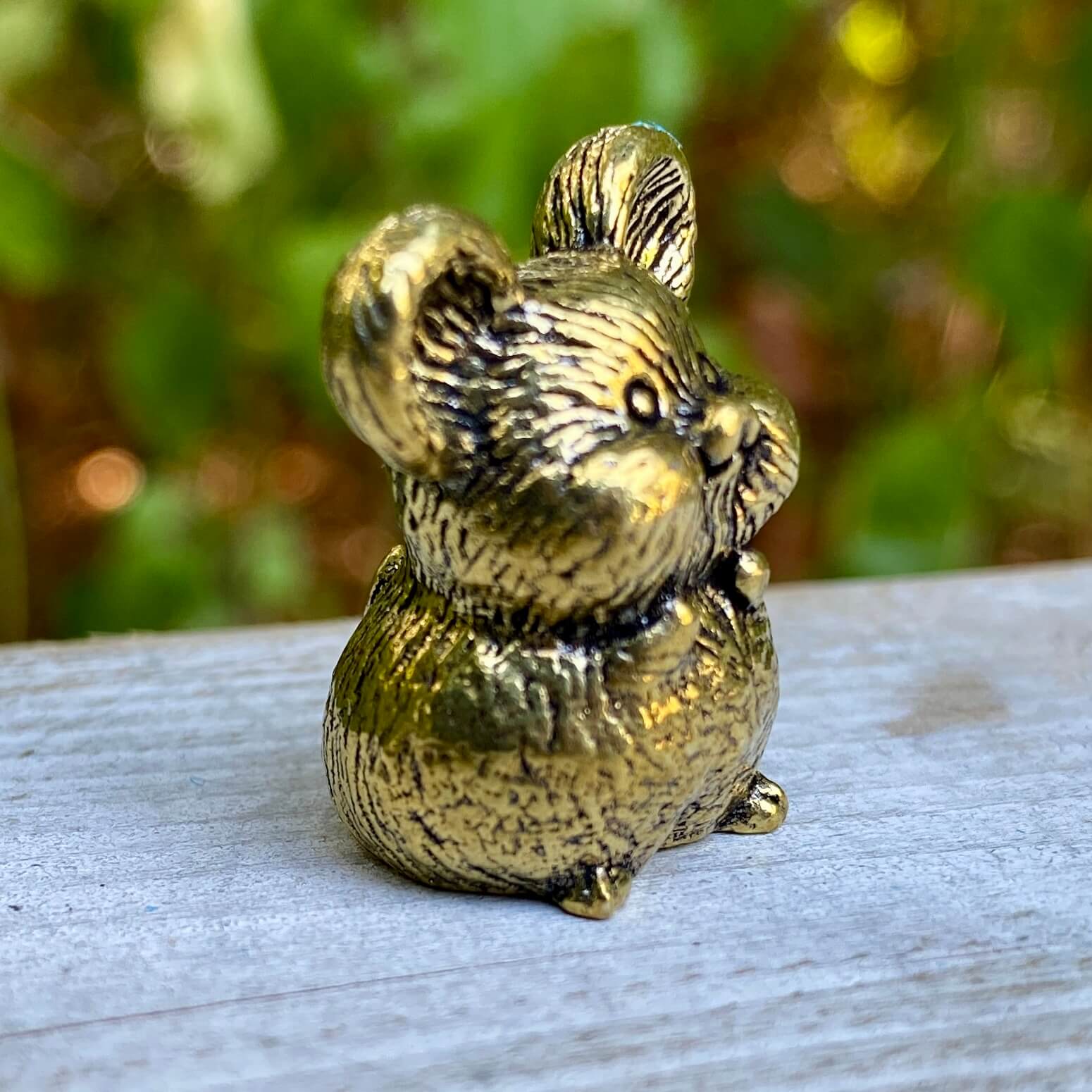 Solid brass mouse sculpture by Wild Brass, symbolizing curiosity, adaptability, and awareness, with detailed craftsmanship.