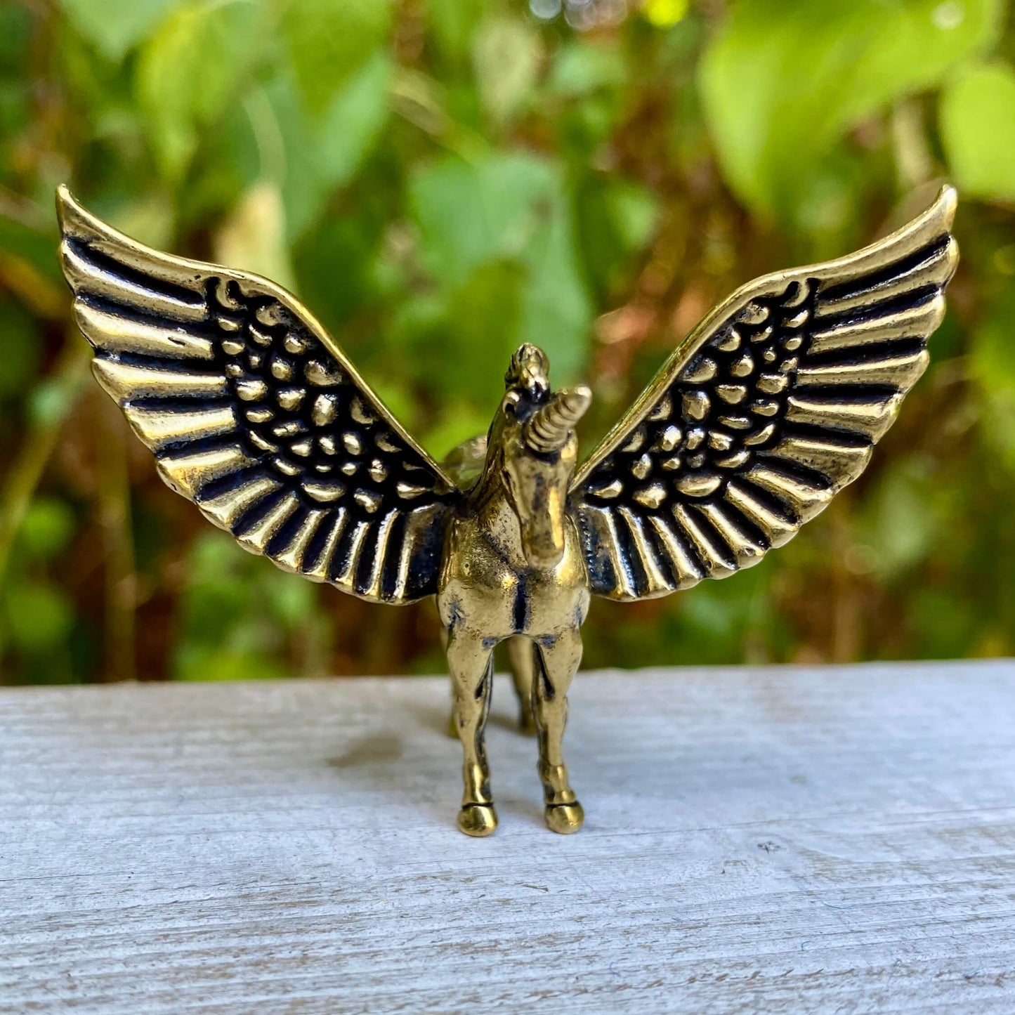 Solid brass Pegasus sculpture by Wild Brass featuring detailed wings and dynamic pose, symbolizing freedom and divine power.