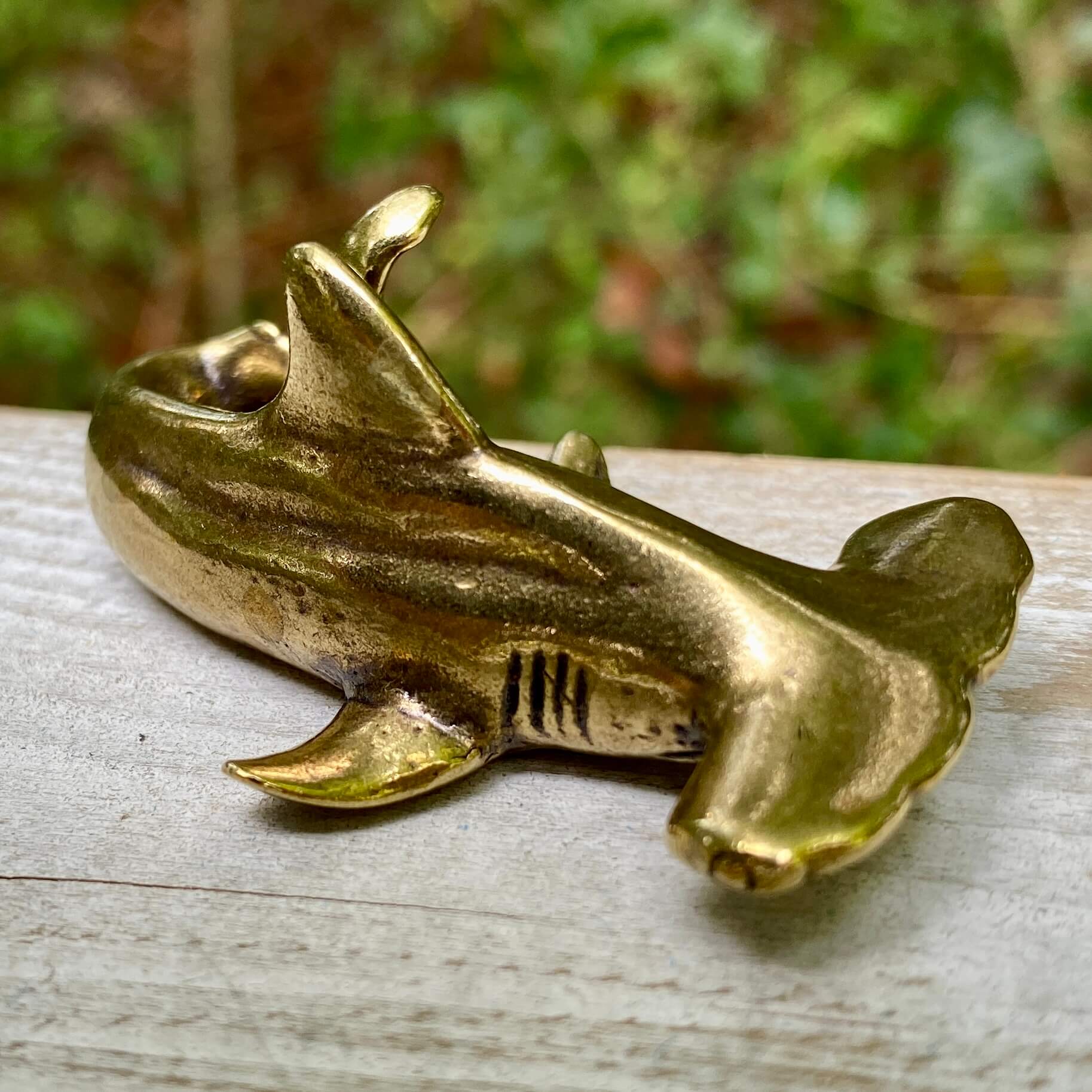 Solid brass hammerhead shark figurine by Wild Brass, showcasing detailed features of the marine predator with a polished brass finish.