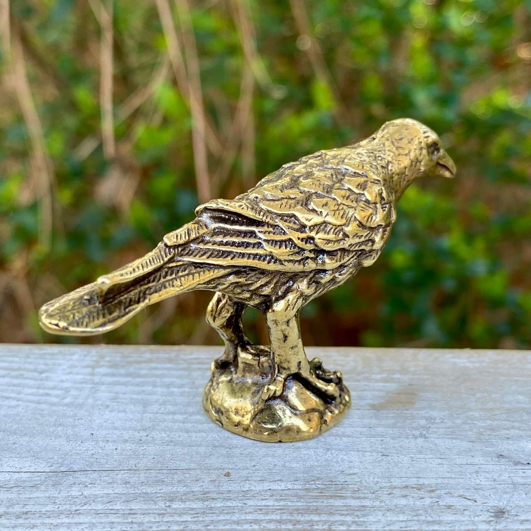 Solid brass raven figurine by Wild Brass, symbol of intelligence, wisdom, and prophecy, detailed and crafted with a polished finish.