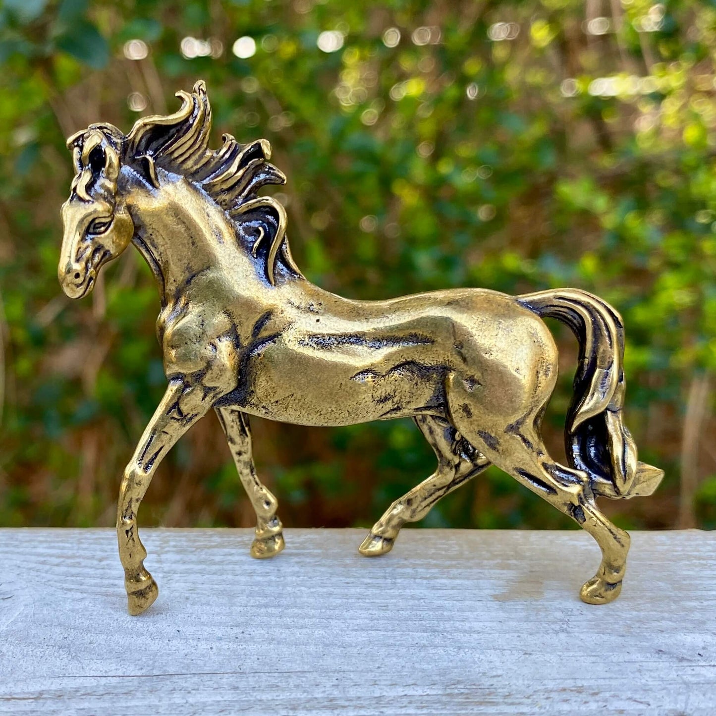 Solid brass horse stallion sculpture by Wild Brass, showcasing a detailed, powerful horse symbolizing freedom and grace.