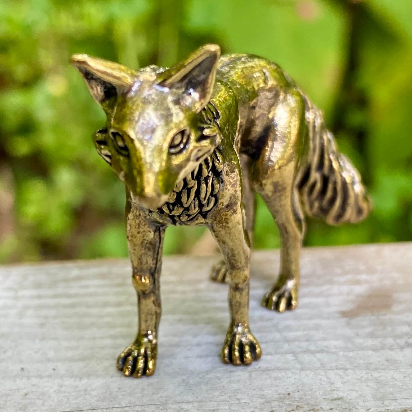 Solid brass fox statue from Wild Brass, symbolizing cleverness and adaptability, with detailed features and a polished finish.
