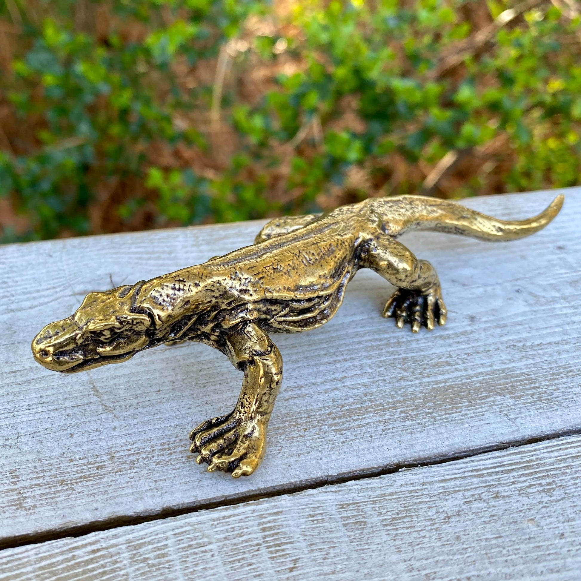 Solid brass Komodo dragon sculpture by Wild Brass, symbol of strength, wisdom, and instinct, detailed and polished for display.